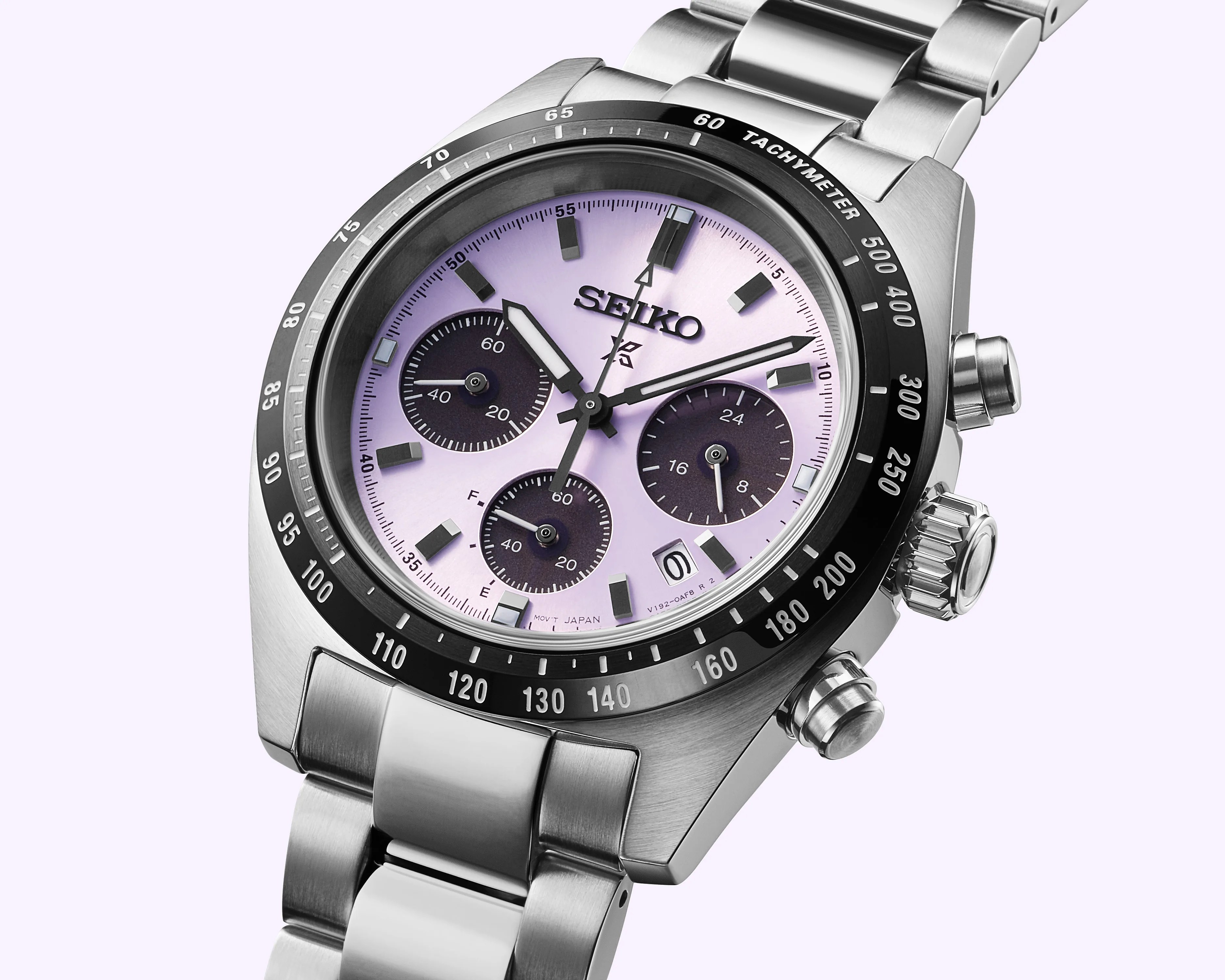 a Seiko watch with a purple dial