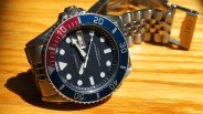 a seiko dive watch with a blue dial