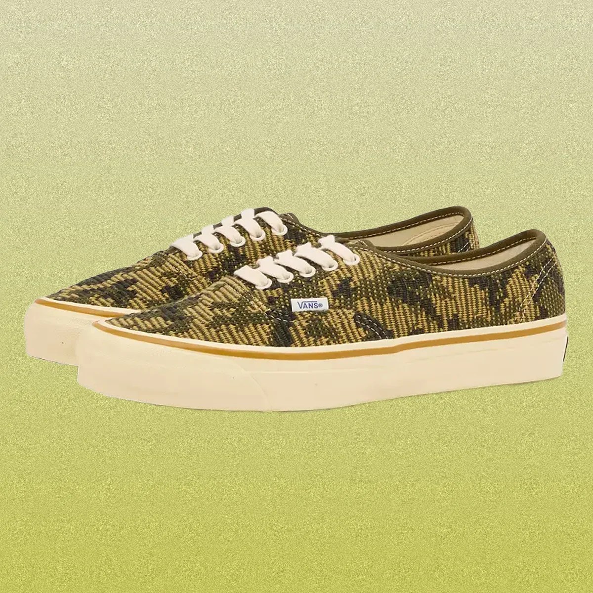 a pair of camo embroidered canvas vans sneakers