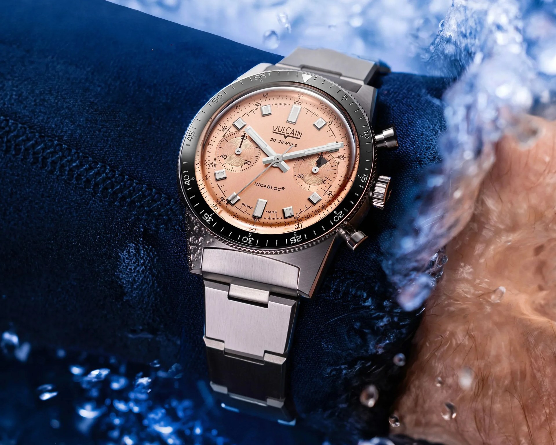 a salmon colored Vulcain dive watch