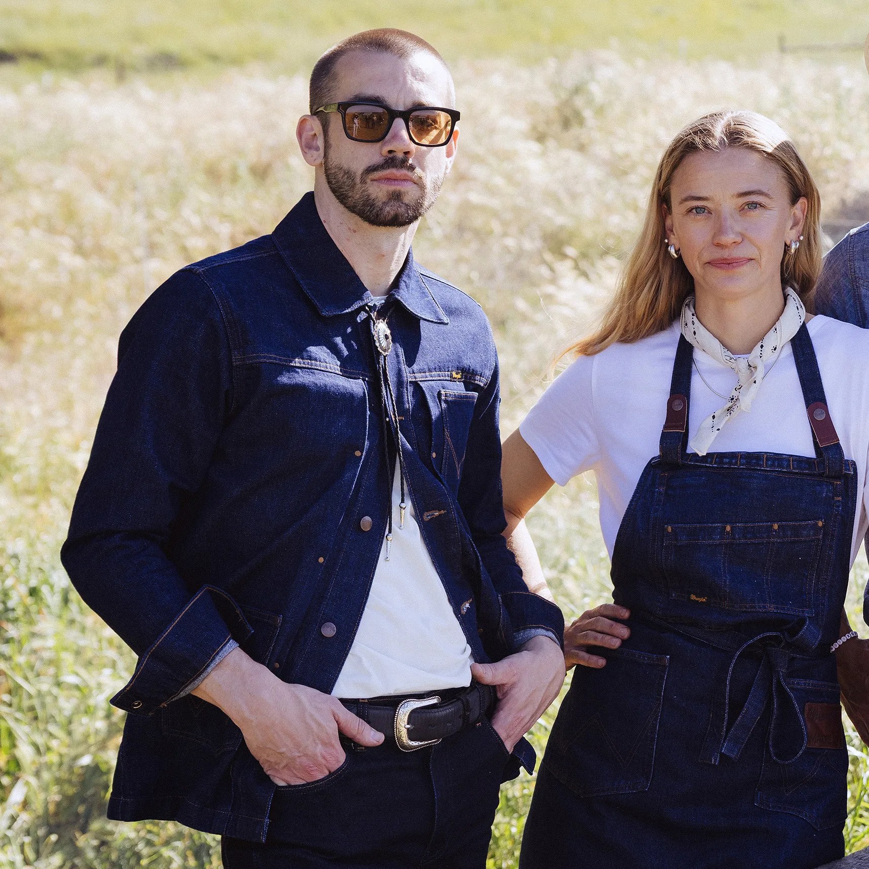 a man and woman un denim chef's gear