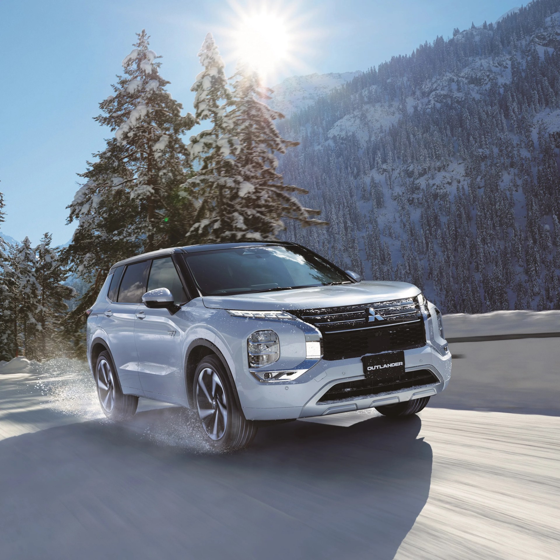 a photo of a mitsubishi outlander driving on snow