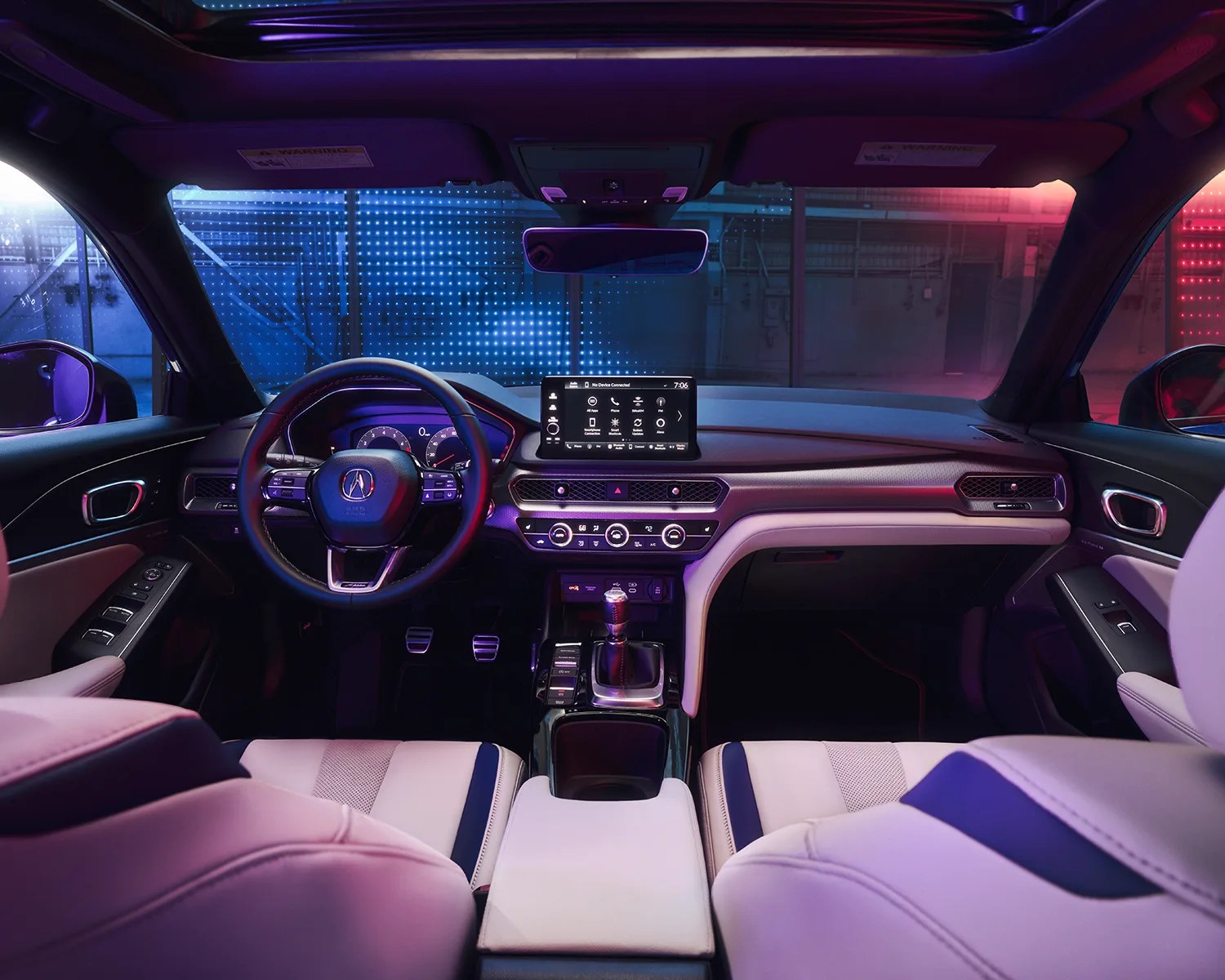 a moody shot showing the interior of an acura integra sports car