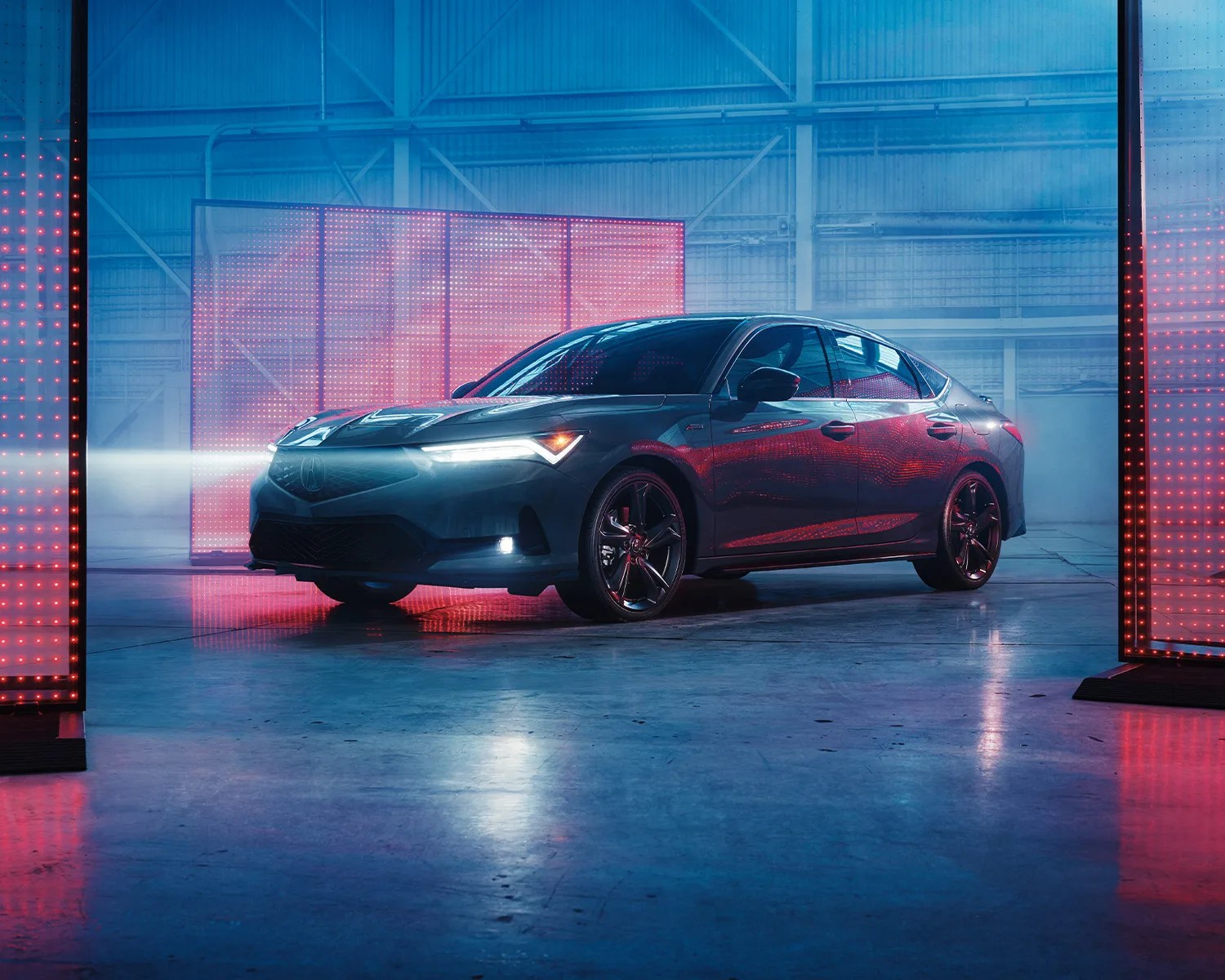 acura integra parked in moody setting with red and blue lighting