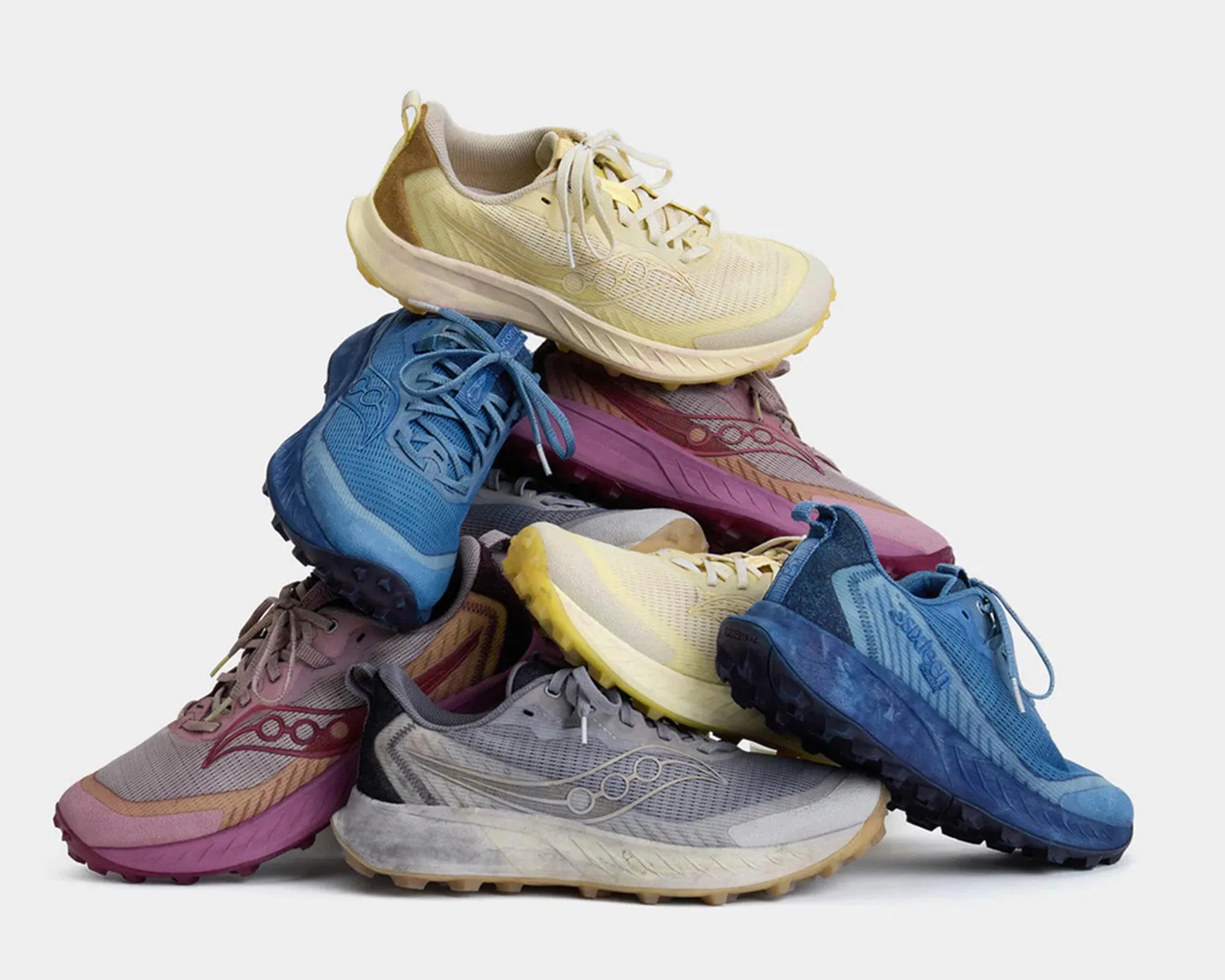 a stack of 3sixteen x Saucony Peregrine 15 Gesso sneakers