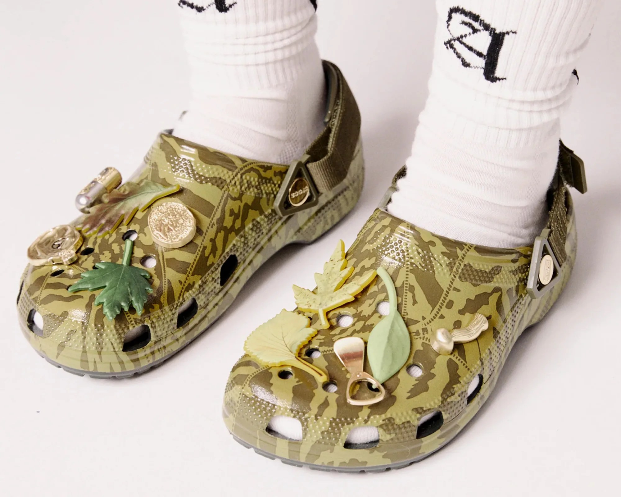 Aries Arise x Crocs Classic Clog on socked feet