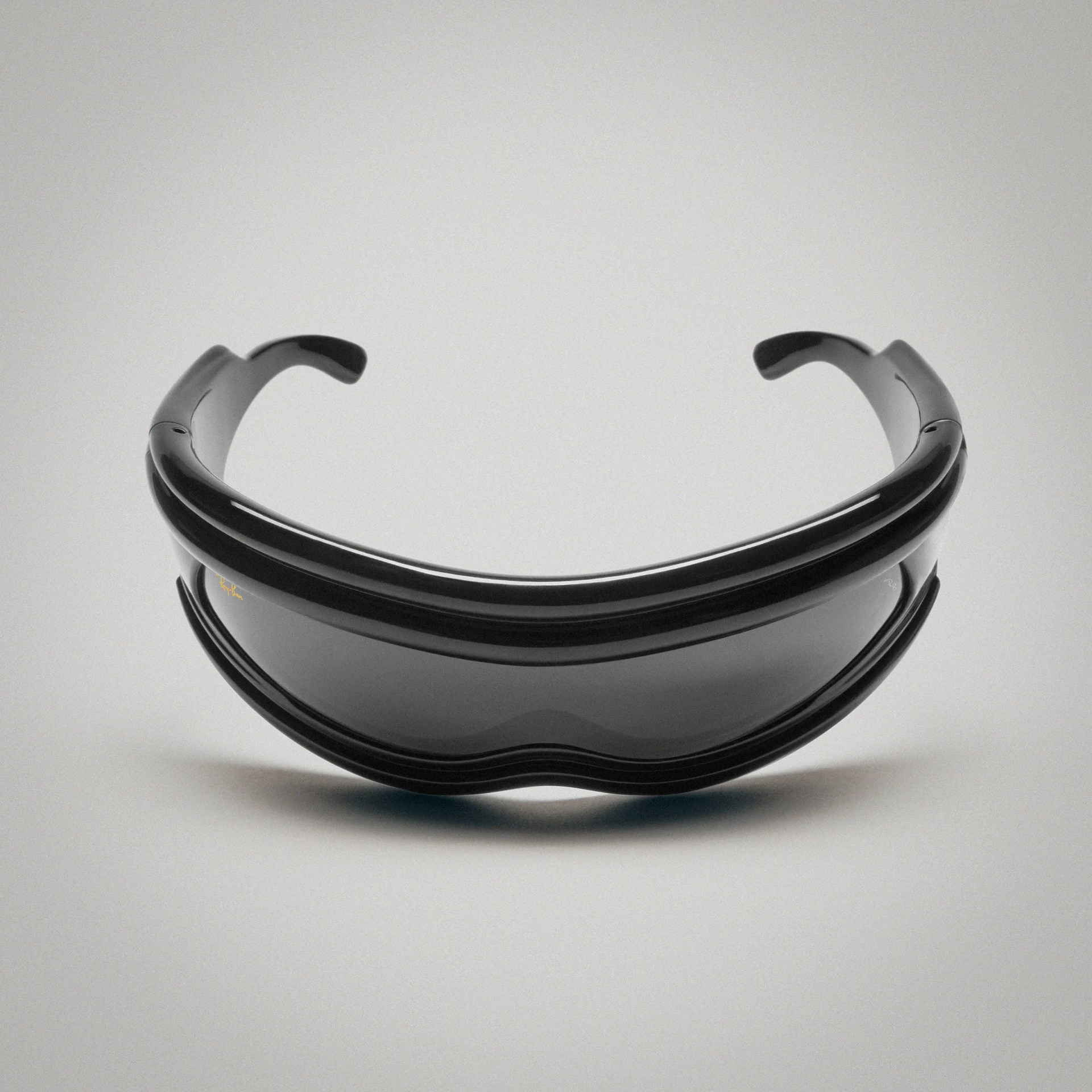 a pair of black Ray-Ban wrap-around sunglasses