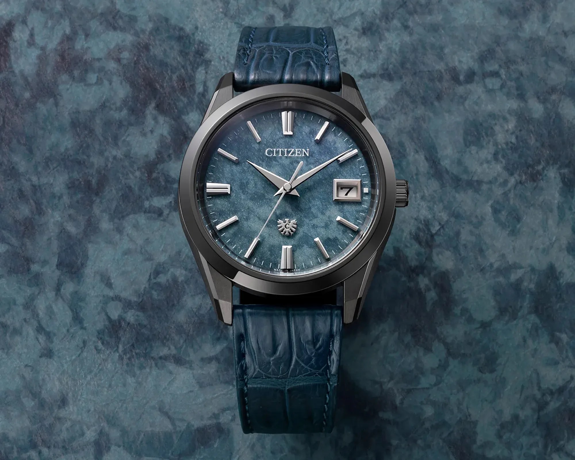 Citizen 30th Anniversary Eco Drive Indigo Washi Murakamo Shibori Dyed Paper Dial Watch AQ4106 26L Watch on background matching dial