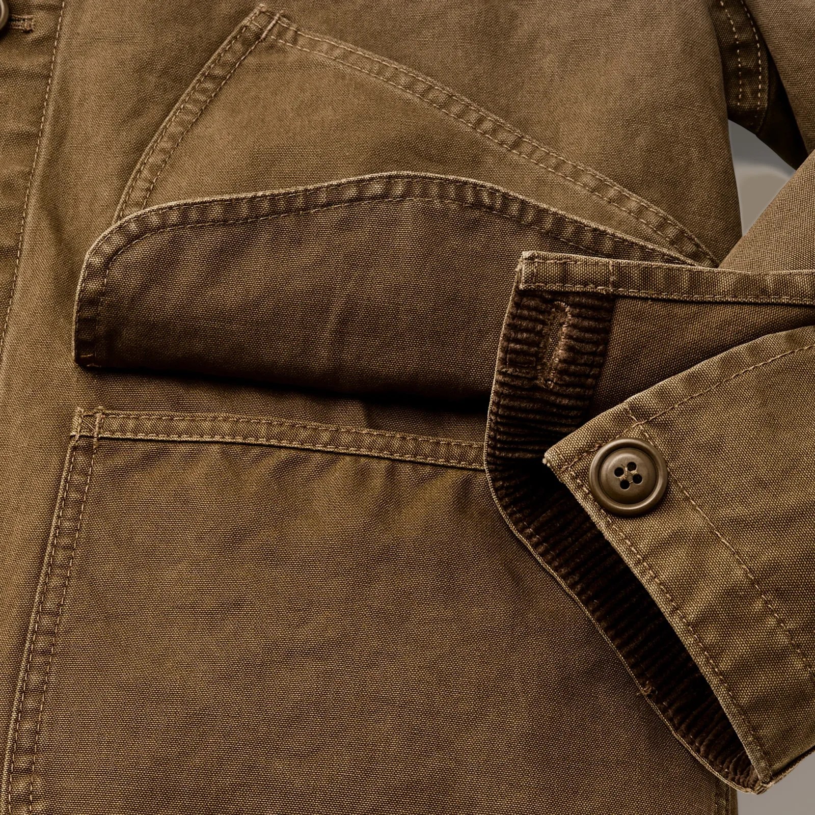 A close-up of the pockets of the Filson Canvas Outfitter Jacket