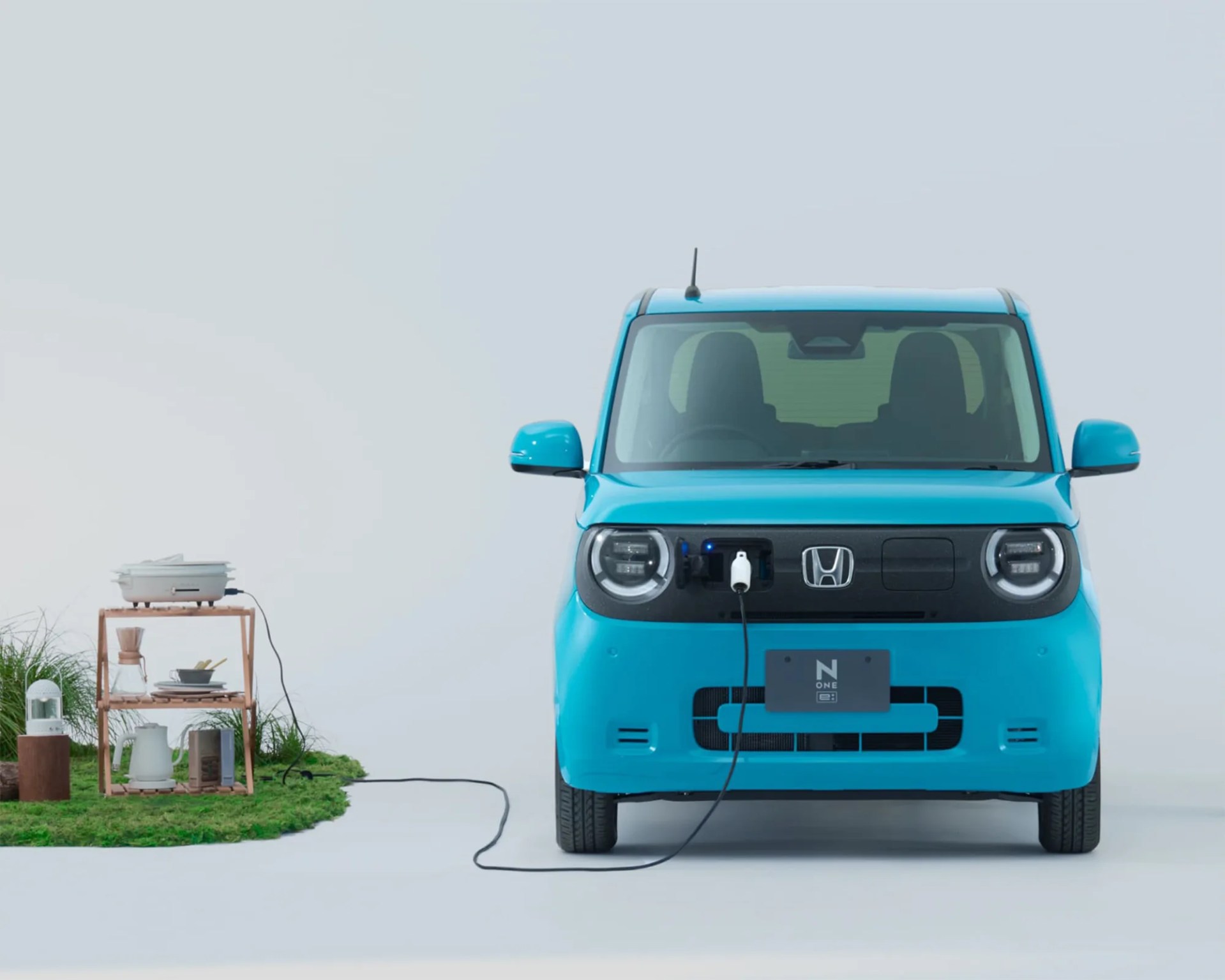 an electric honda compact plugged into an appliance