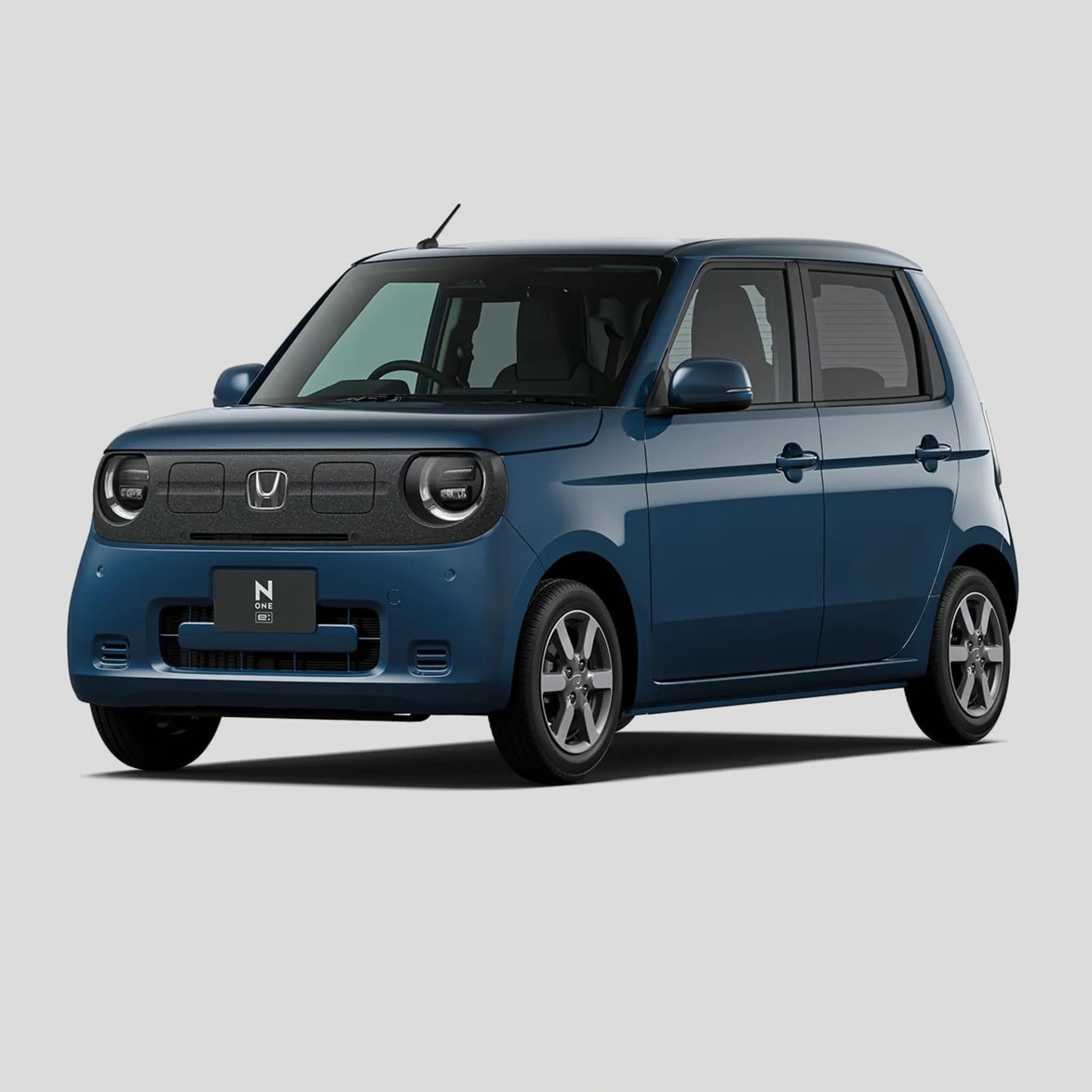 a dark blue honda electric compact car