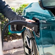 hand holding charger plugged into Honda prologue