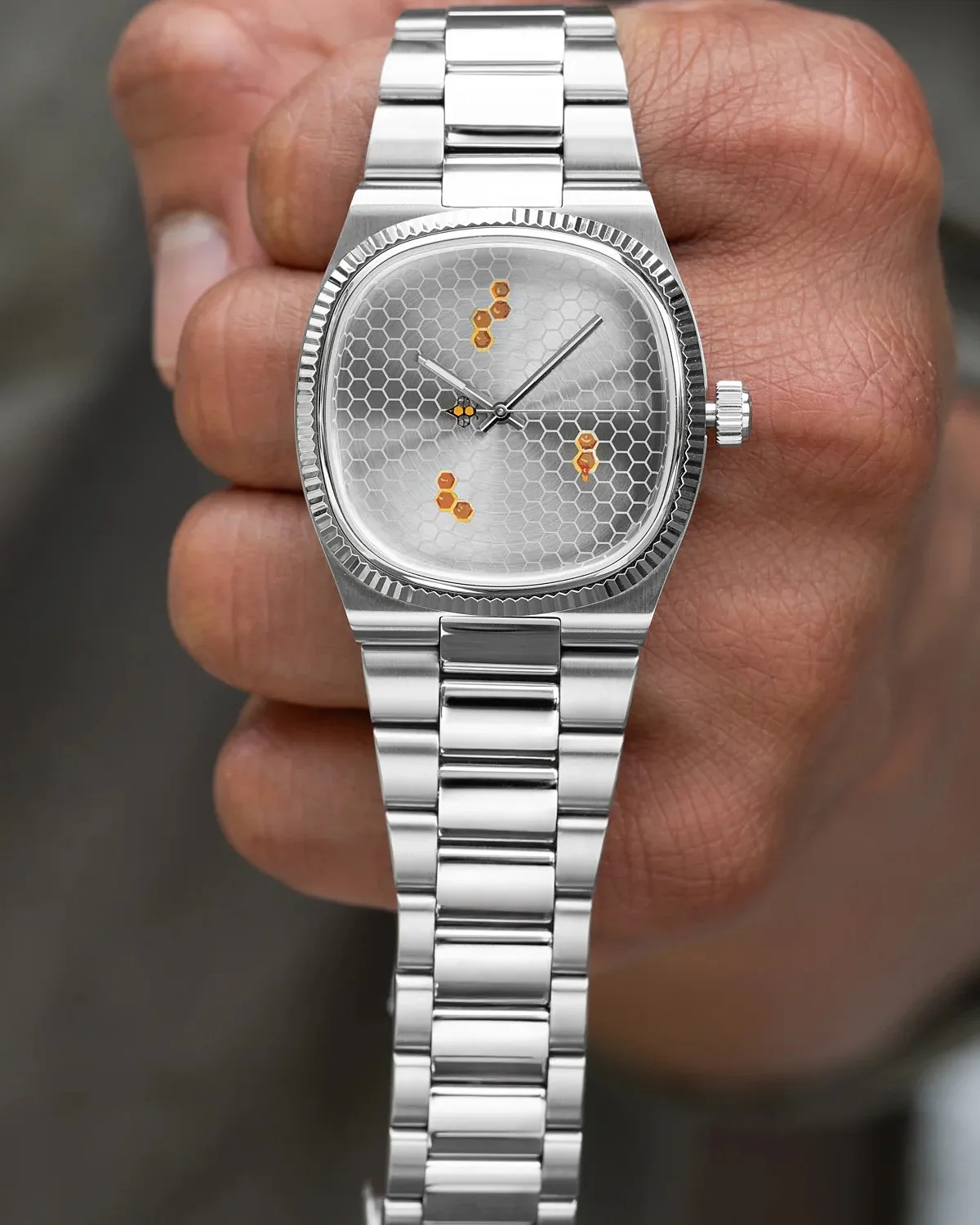 a watch with honeycomb dial