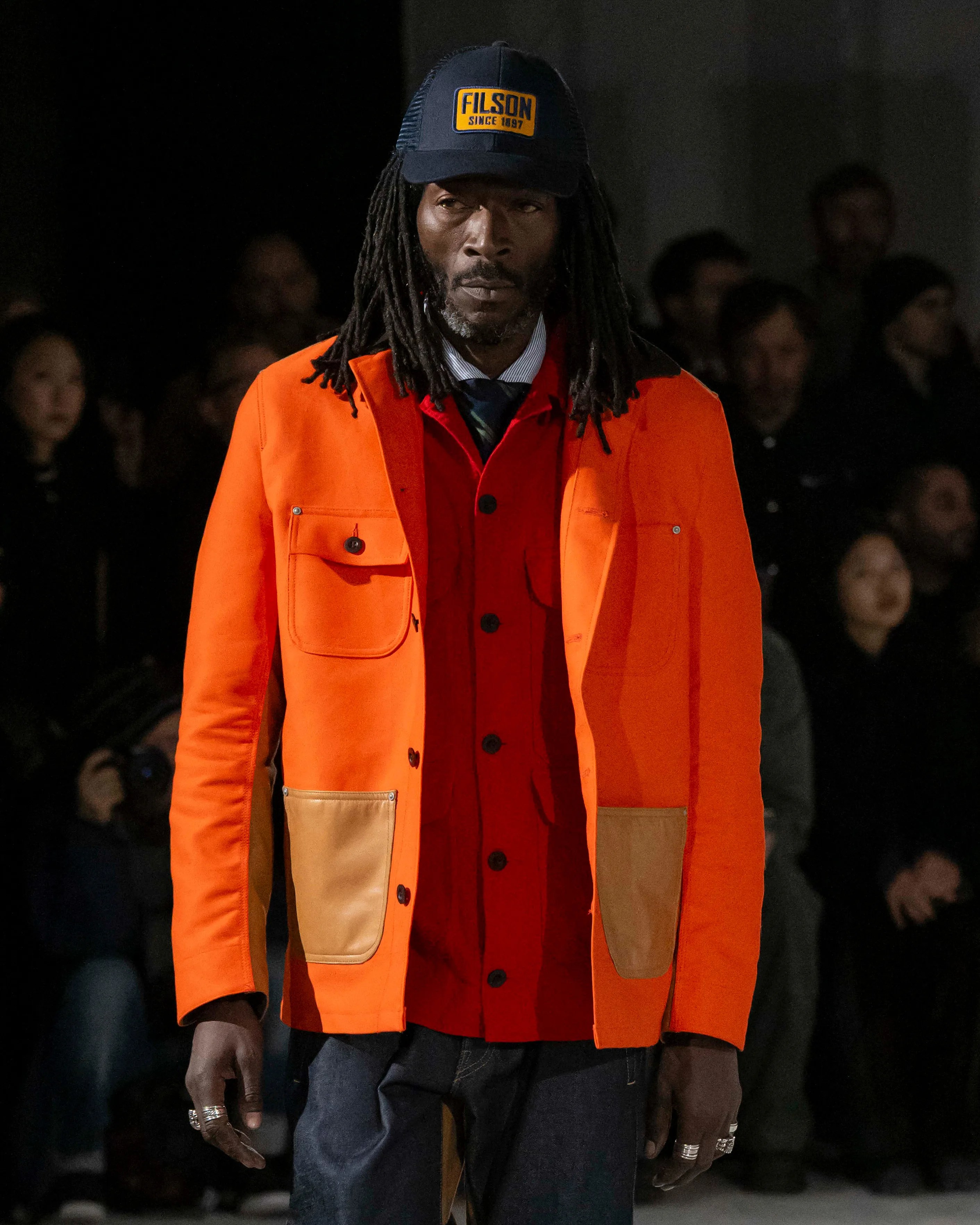 a man in a Filson Junya Watanabe Man jacket