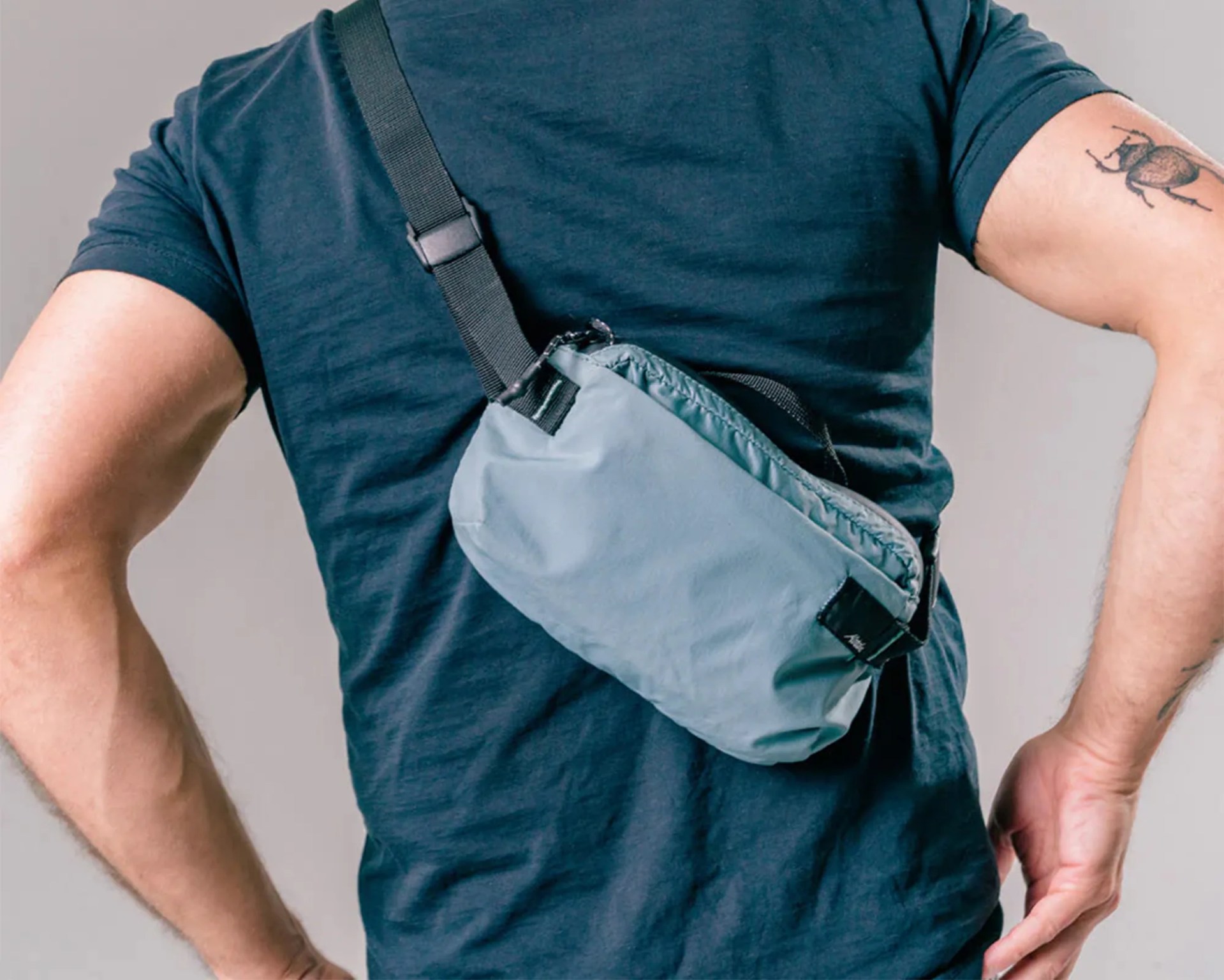 Person wearing Matador ReFraction Packable Sling on back