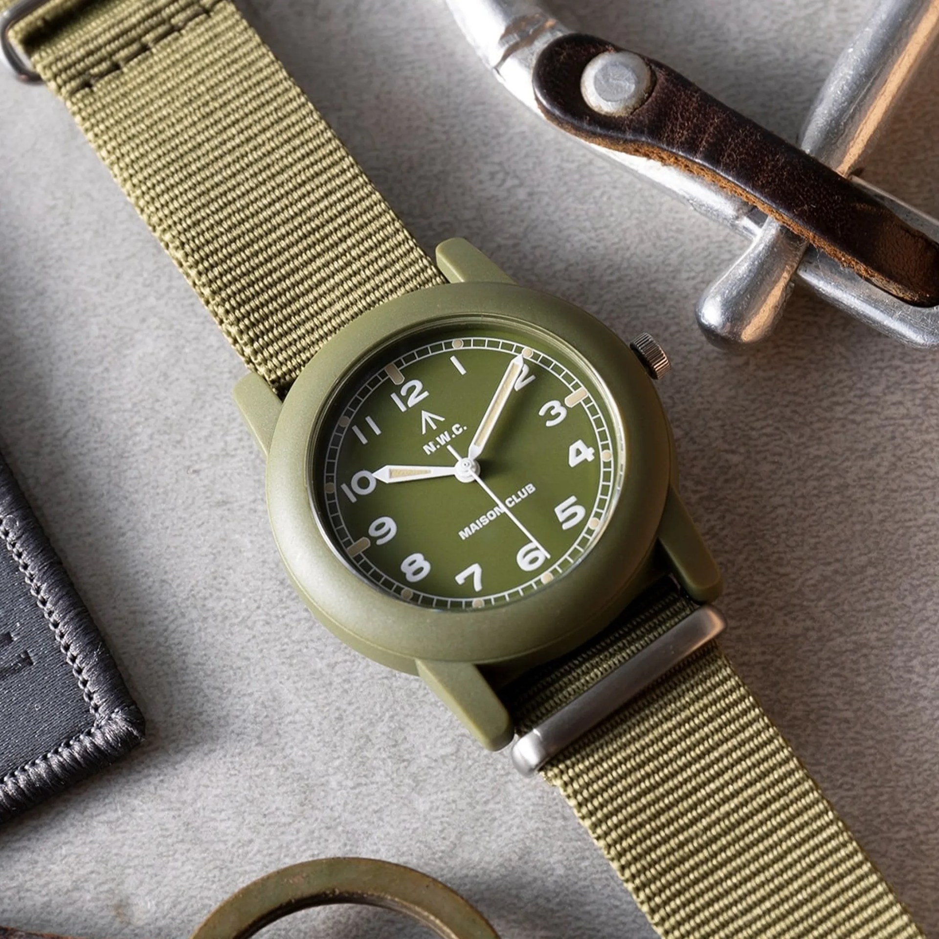 Naval Watch x Maison Club Mil 08 Field Watch green closeup with EDC items