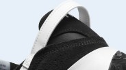 A close-up of the hell of the Nike Waffle Debut sneaker in black