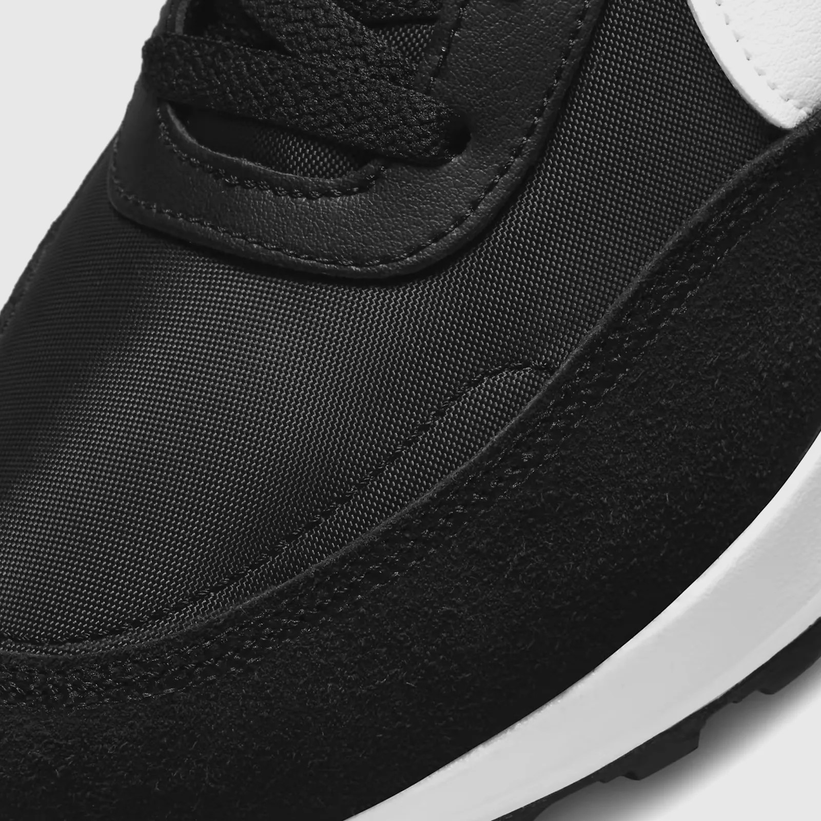 A close-up of the toe material on the Nike Waffle Debut sneaker