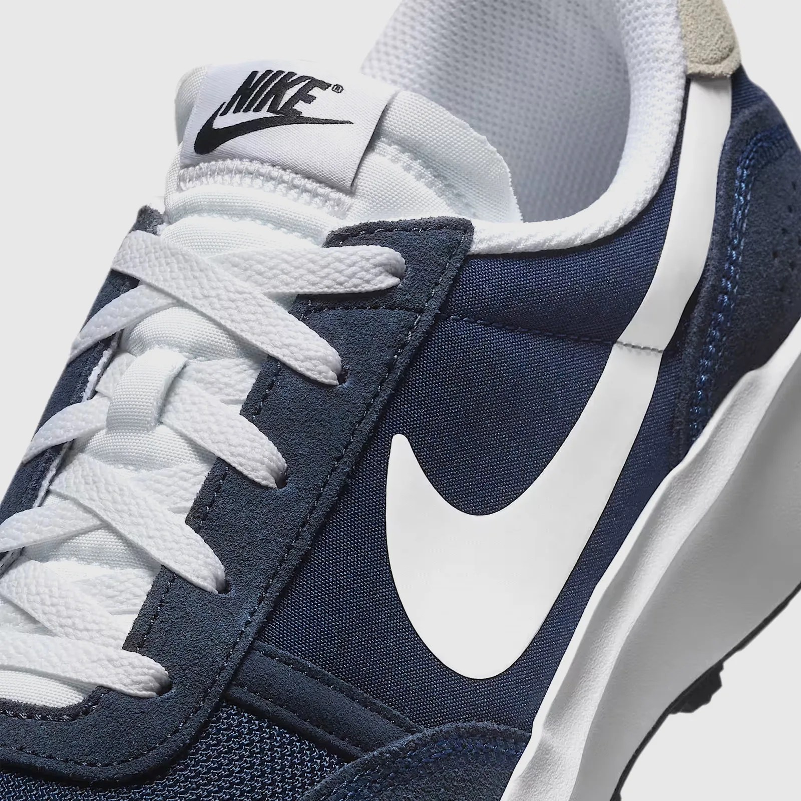 A close-up of the upper of the Nike Waffle Nav in Mightnight Blue