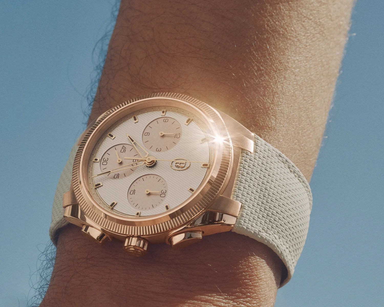 a Parmigiani Fleurier watch on a mans wrist