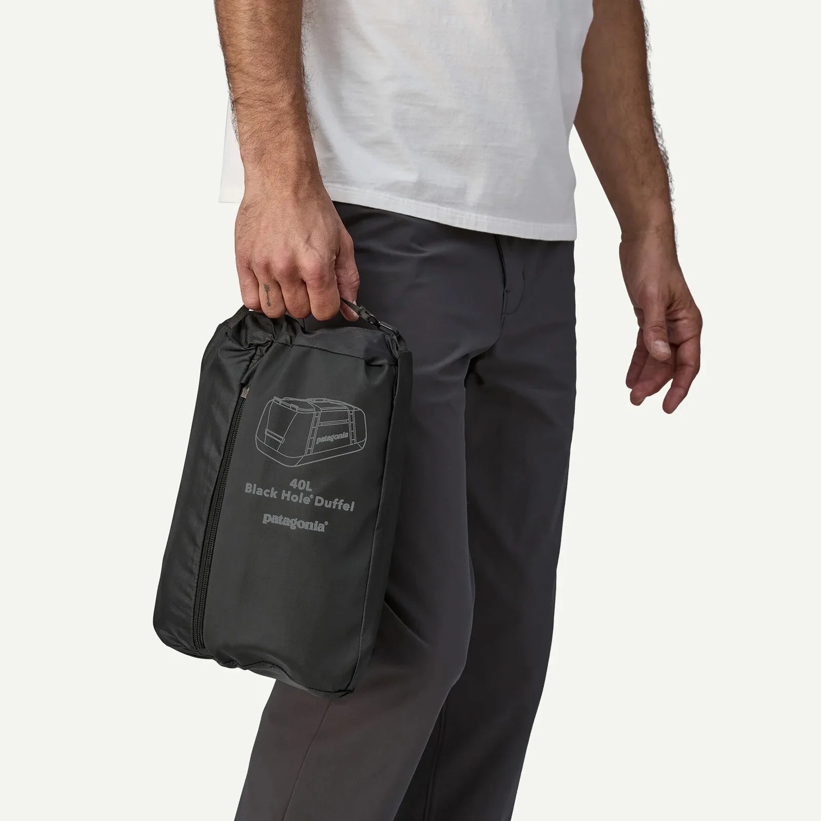 Patagonia black hole duffle shown stuffed down into its own pocket
