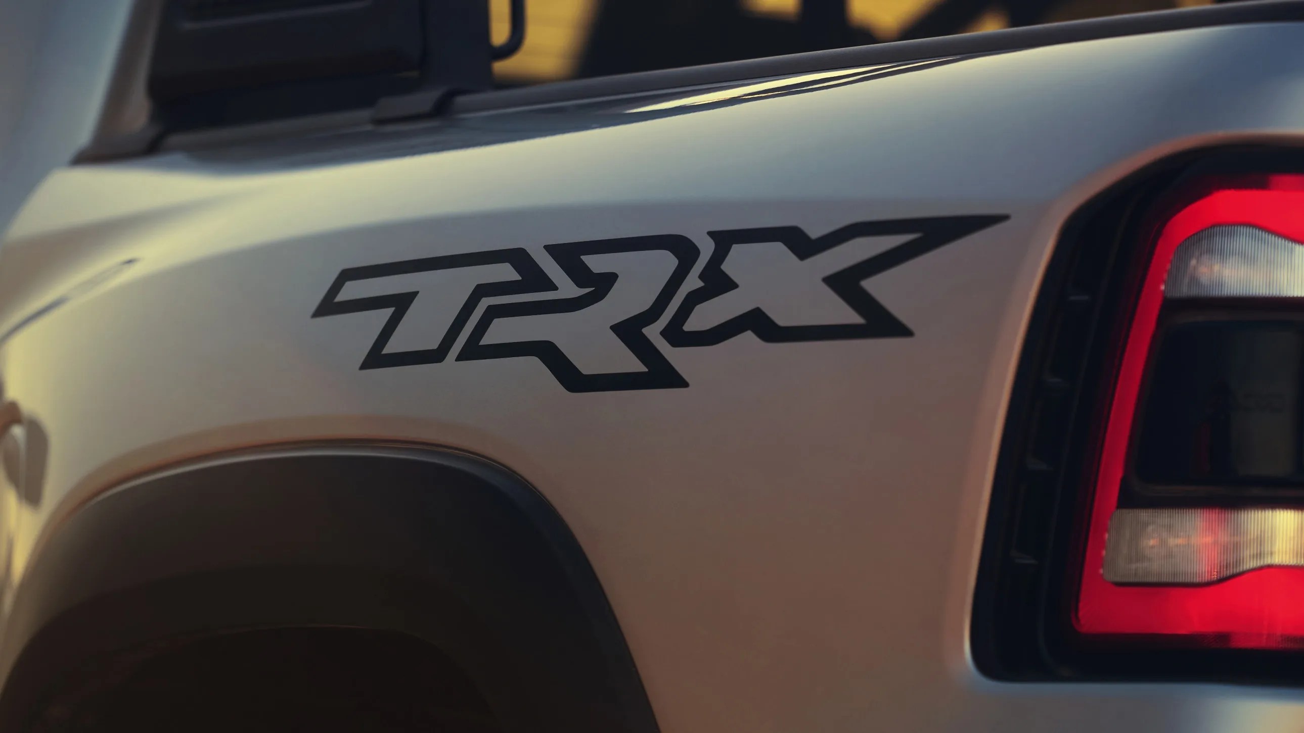 close-up of grey ram 1500 trx rear-left quarter-panel