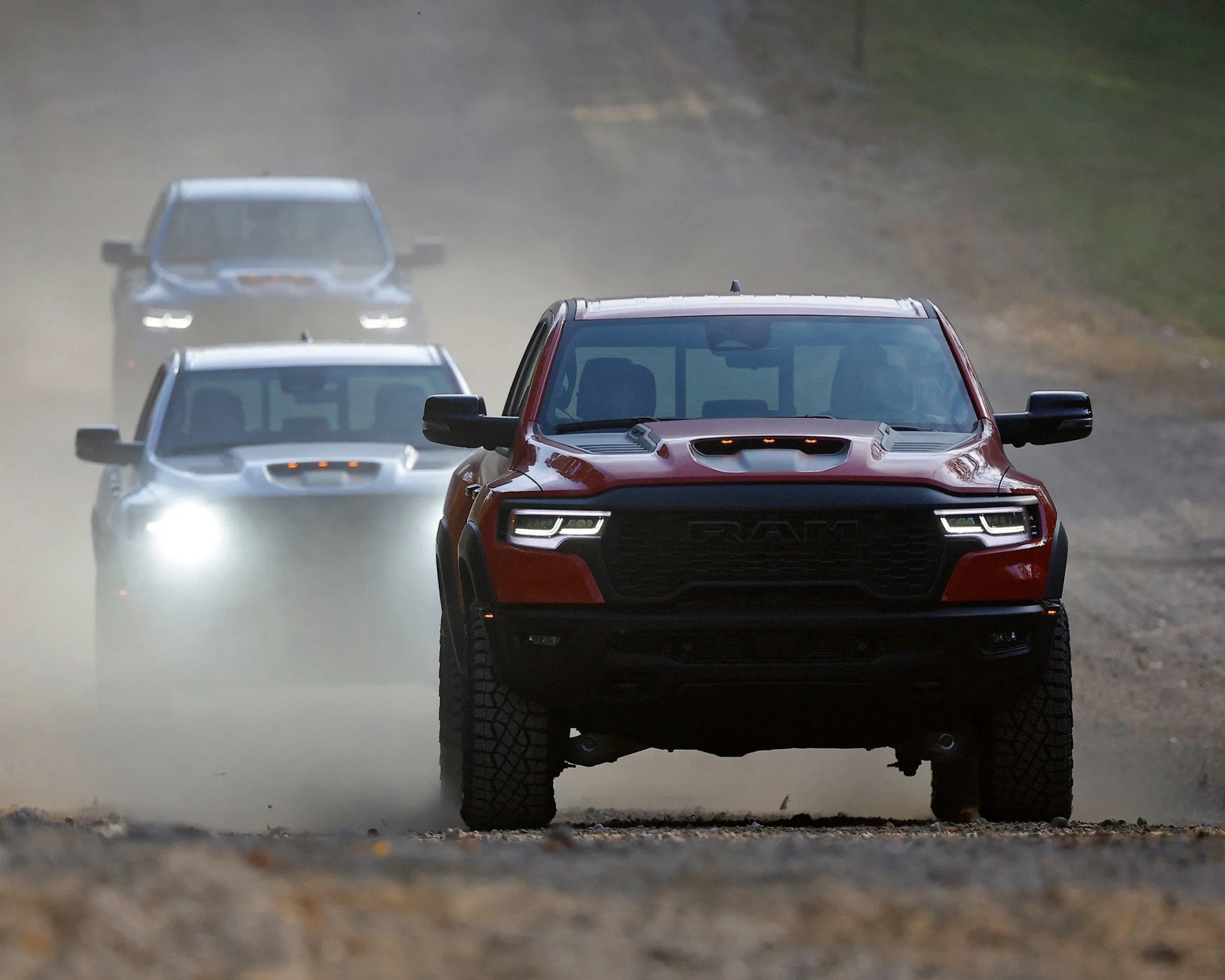 ram rho leading other two other trucks driving