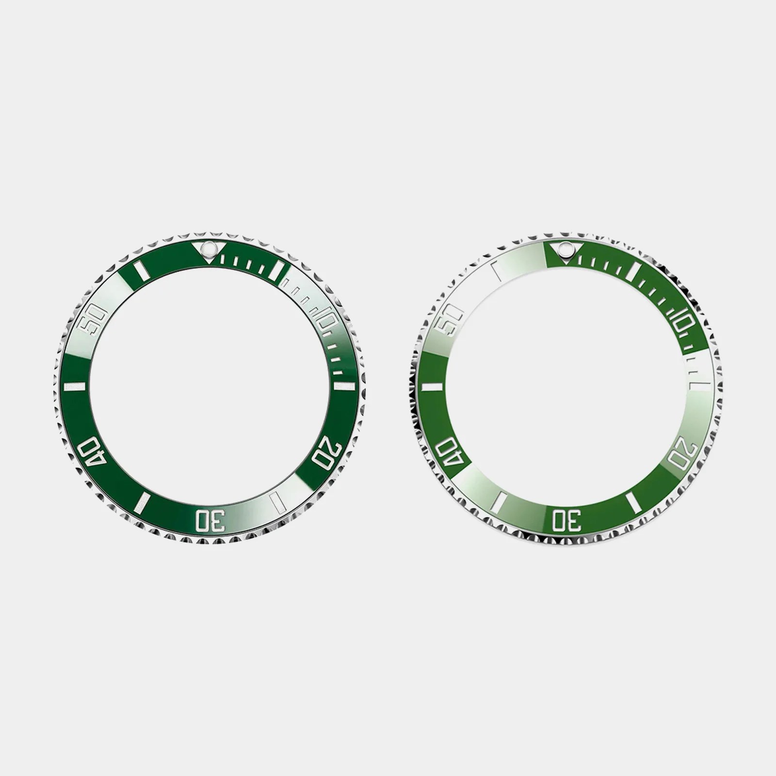 The two different colored bezels of the Rolex Submariner Date 126610LVs shown against a grey background