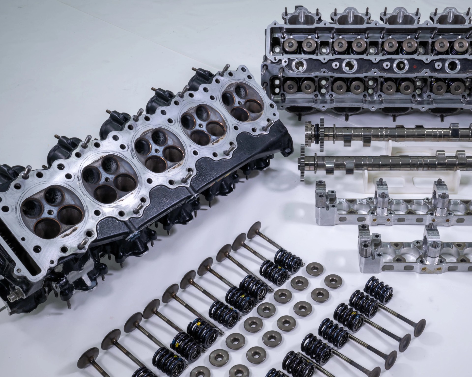 a shot showing the disassmbled top end of a Honda f1 engine