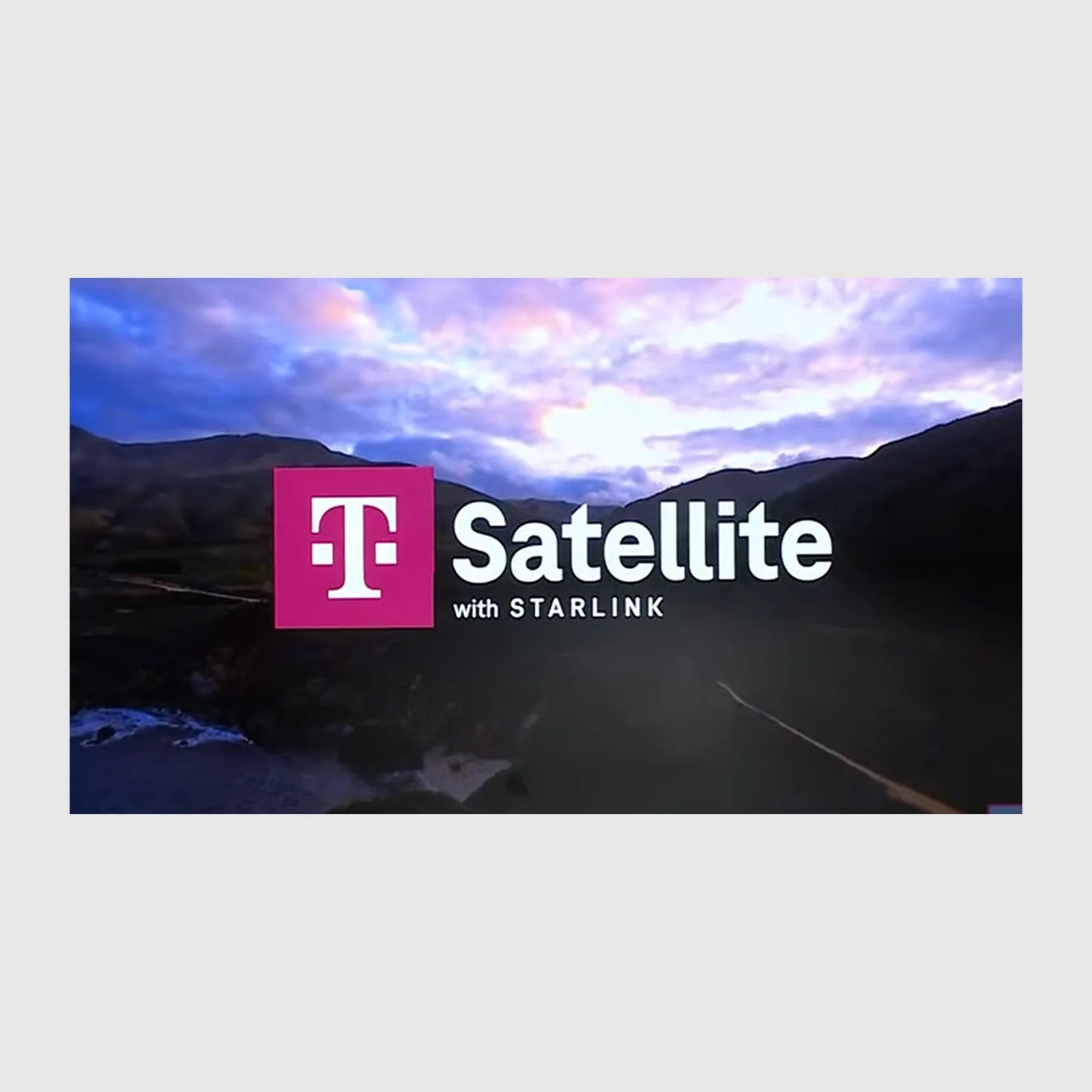 An image of a road winding through mountains with a purple and pink sky covered by the logo T Satellite with Starlink