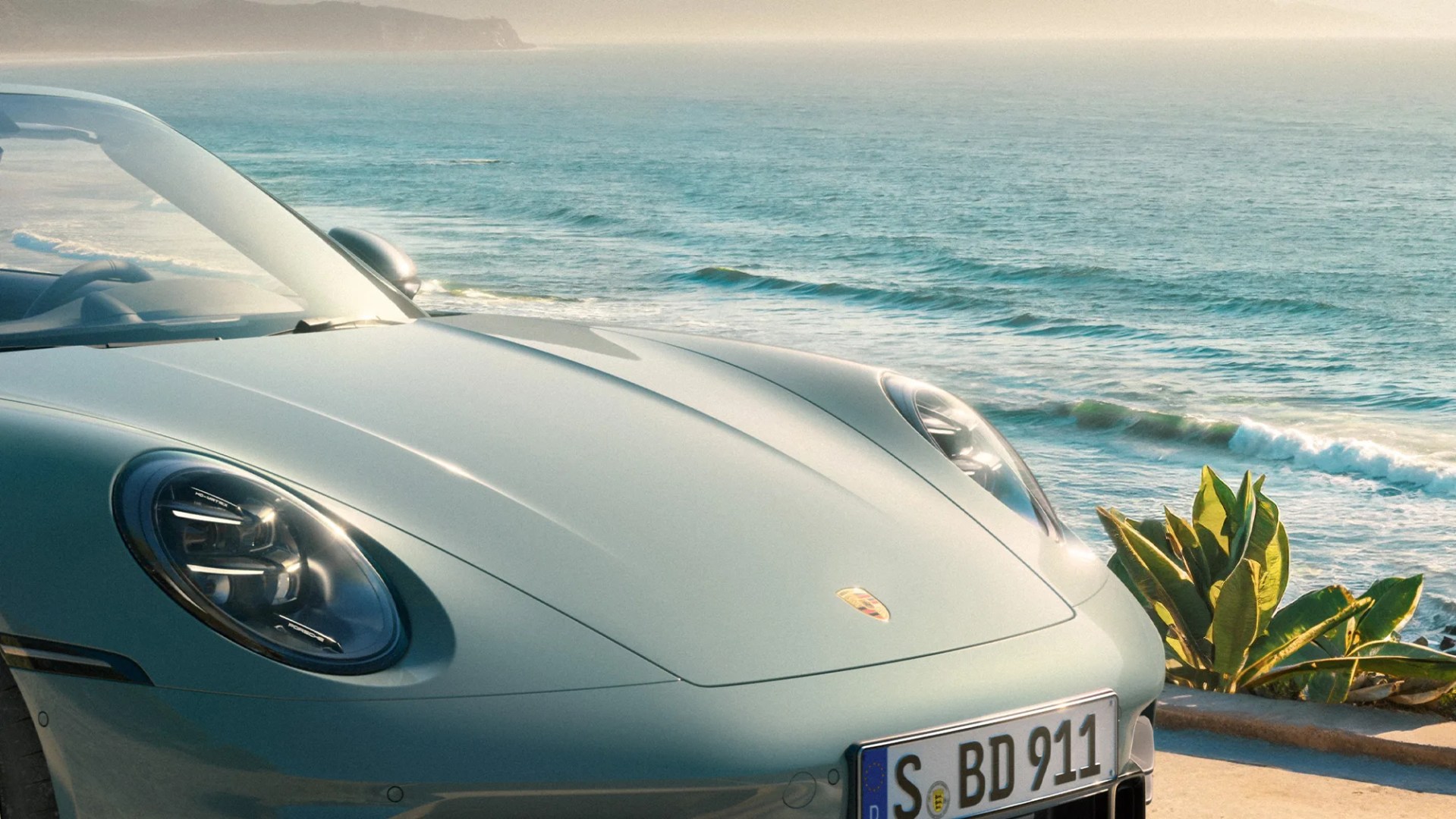 2026 Porsche 911 Cabriolet front-end closeup overlooking California beach