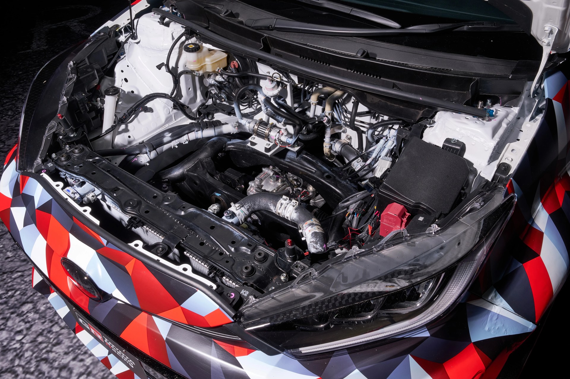 a close-up photo of a toyota yaris engine bay