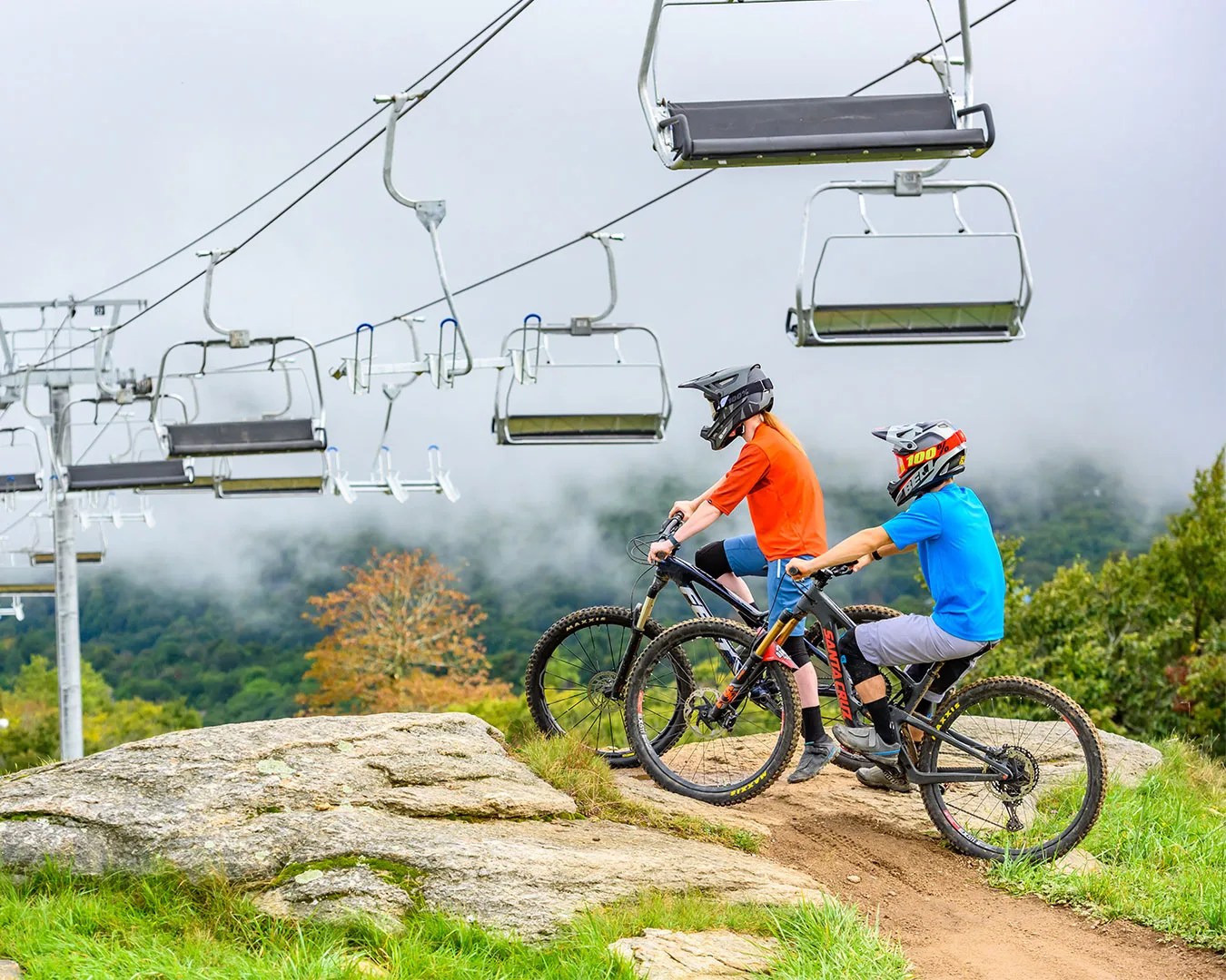 bikers at beech mountain with chair lifts in the background