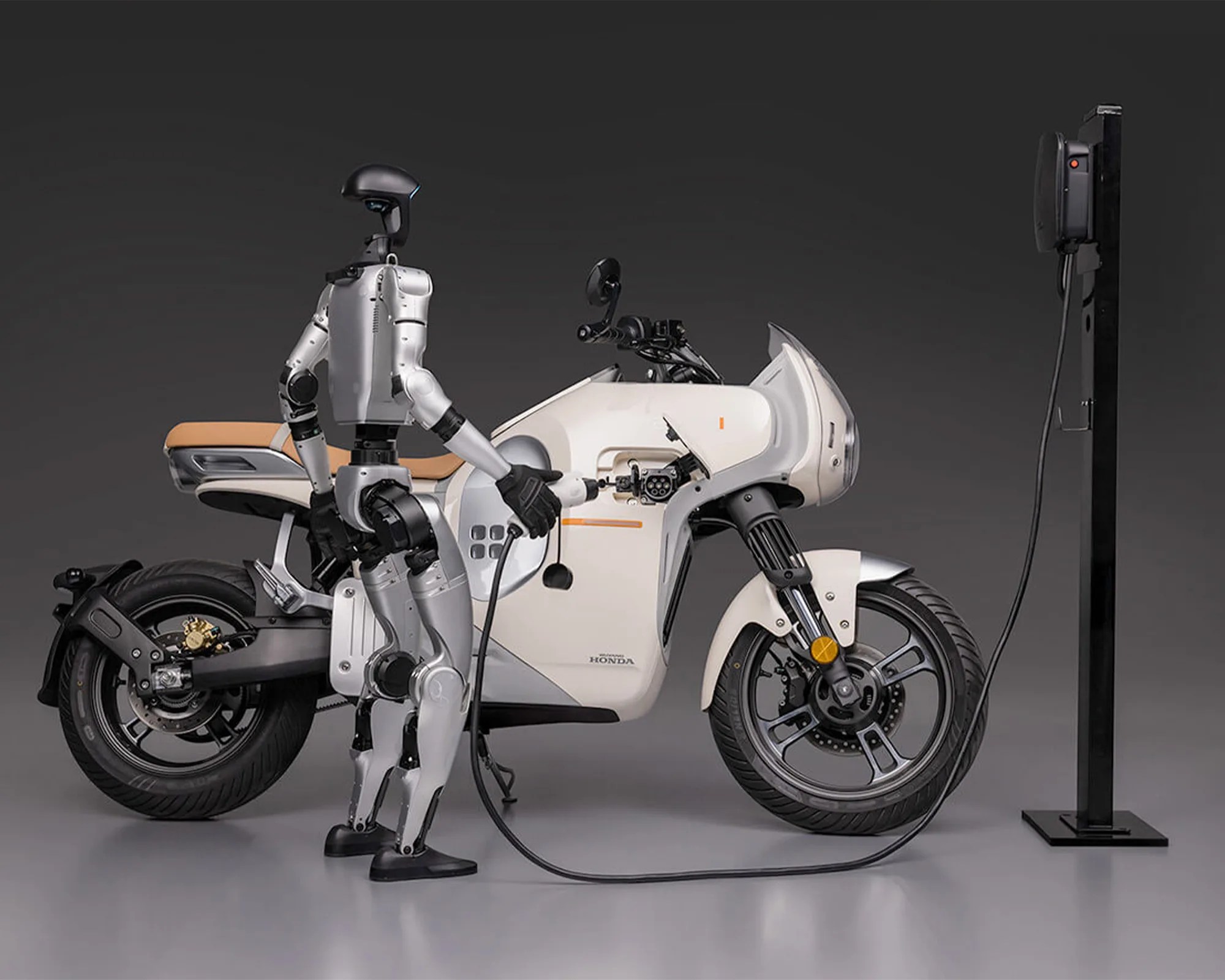 Wuyang-Honda E-Vo Electric Motorcycle being charged by a robot