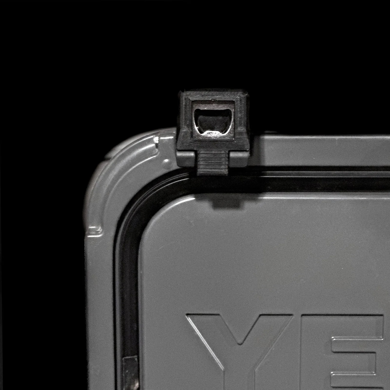 The LatchOutdoors Open Latch shown attached to a grey Yeti Cooler