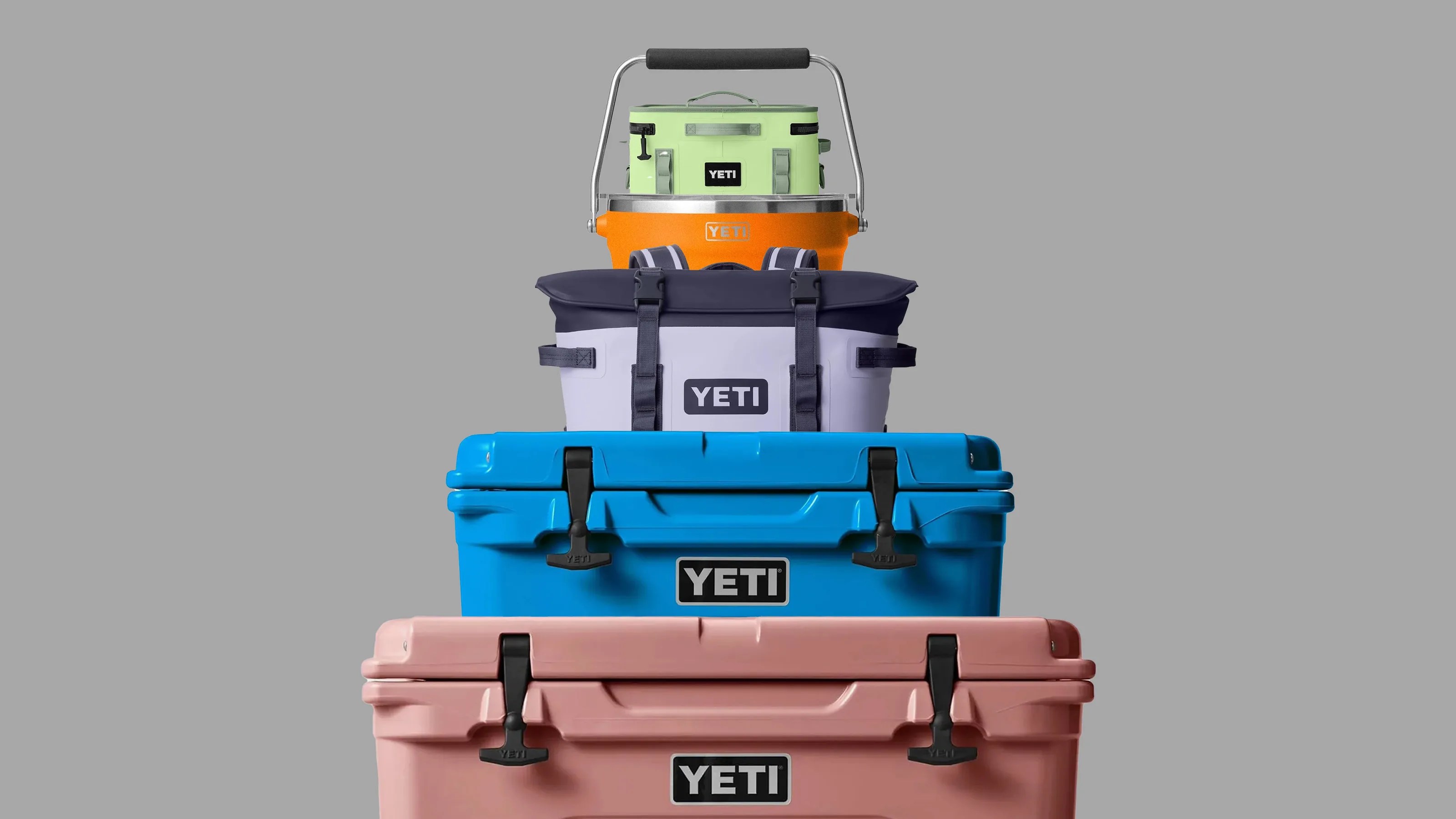 A stack of yeti products in a pyramid against a grey background