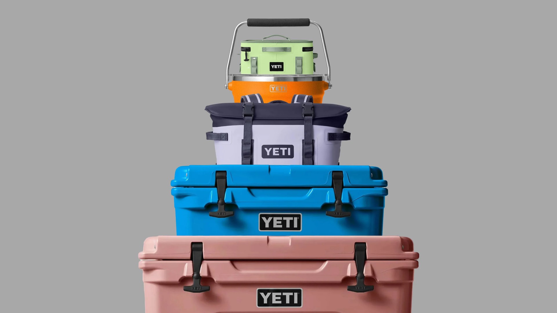 A stack of yeti products in a pyramid against a grey background