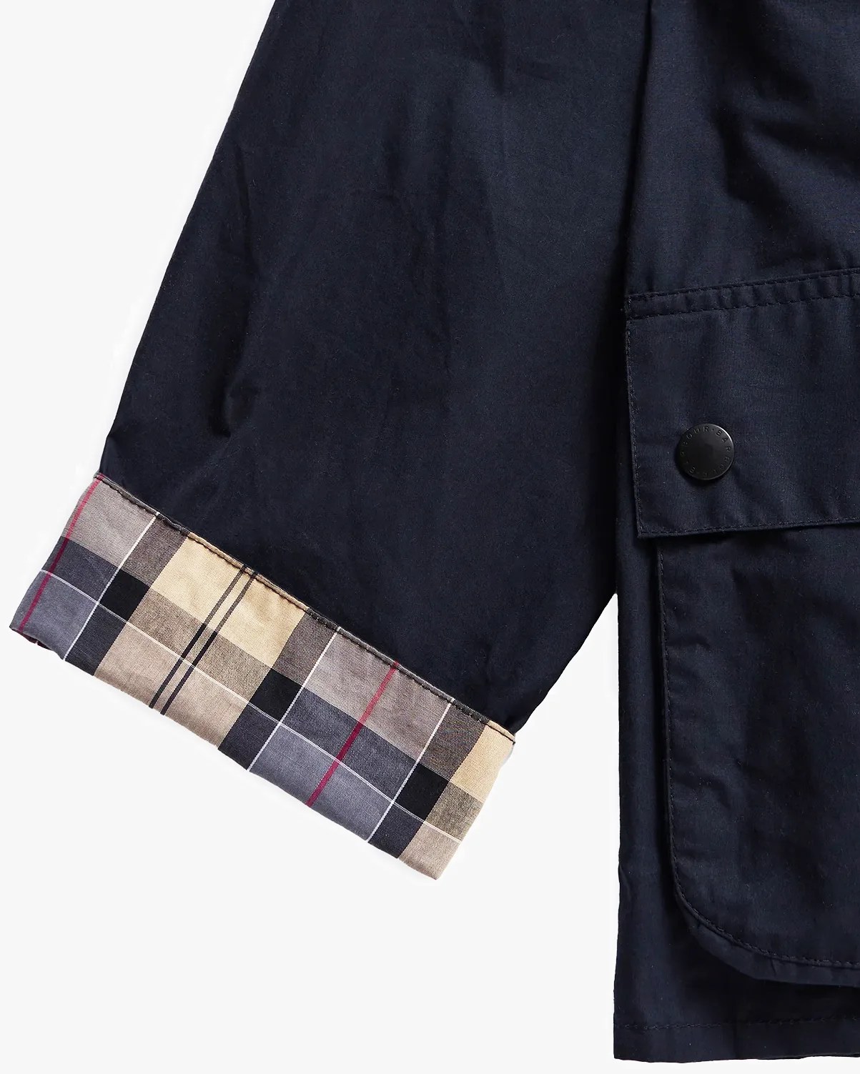 the sleeve of a Barbour jacket