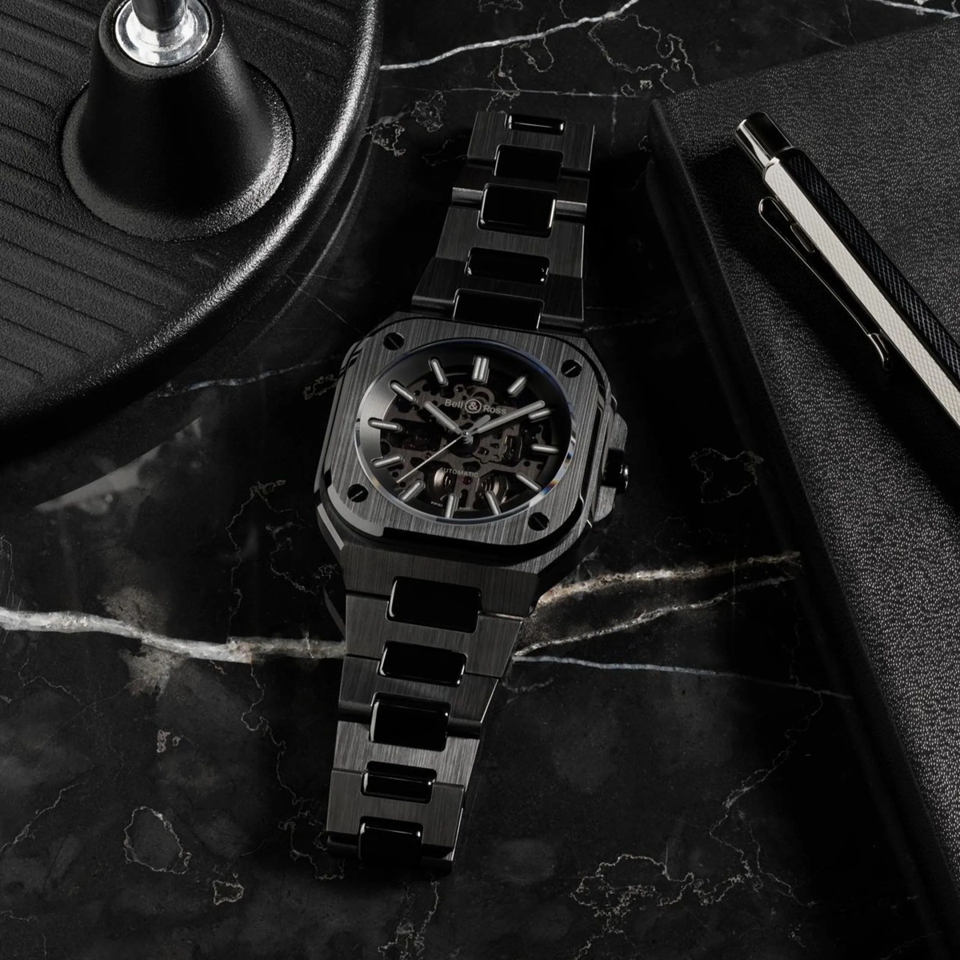a black bell and ross sports watch on a table