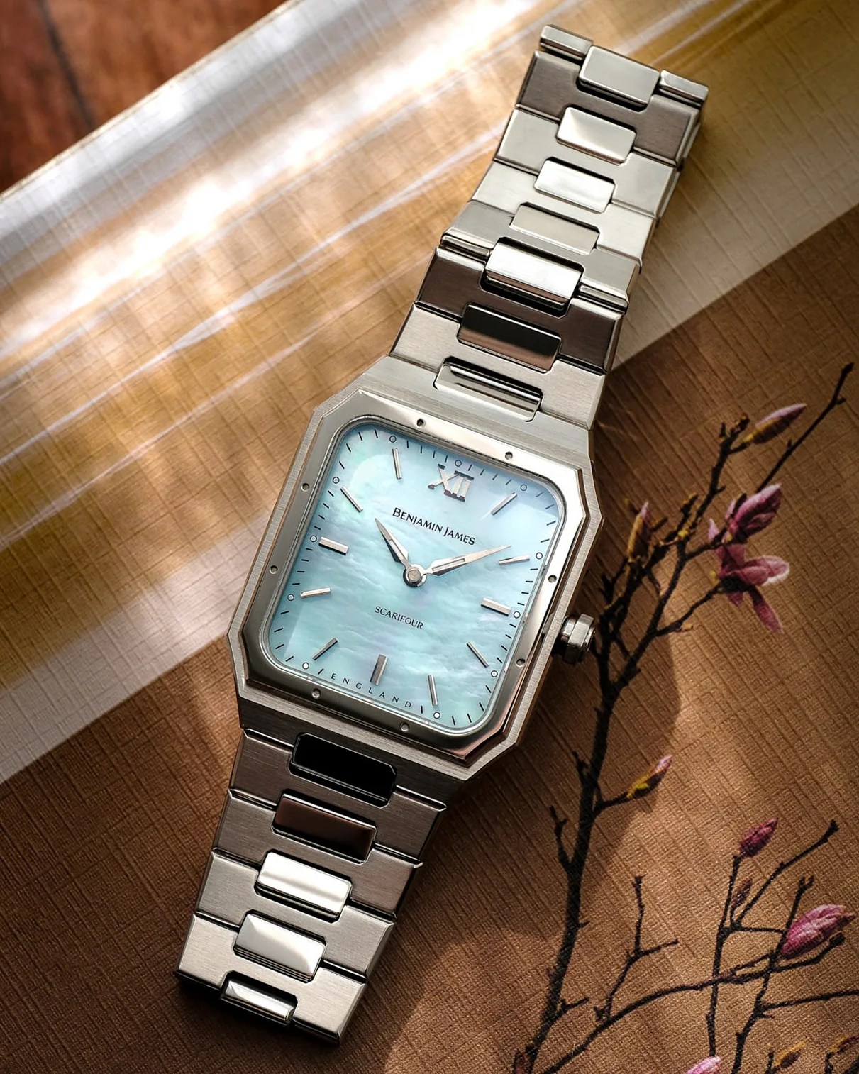a Benjamin James watch laying on a table