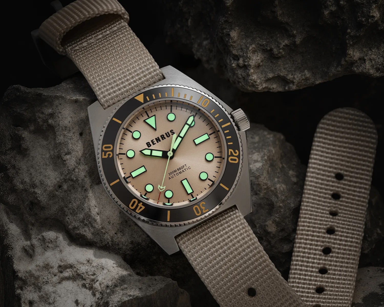 a Benrus watch on some rocks glows in the dark