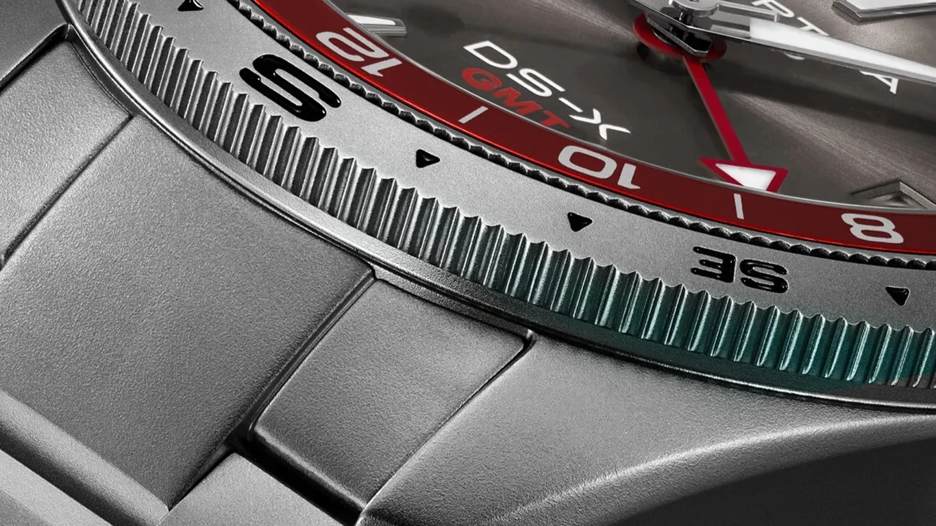 a closeup of the bezel on a certina gmt watch