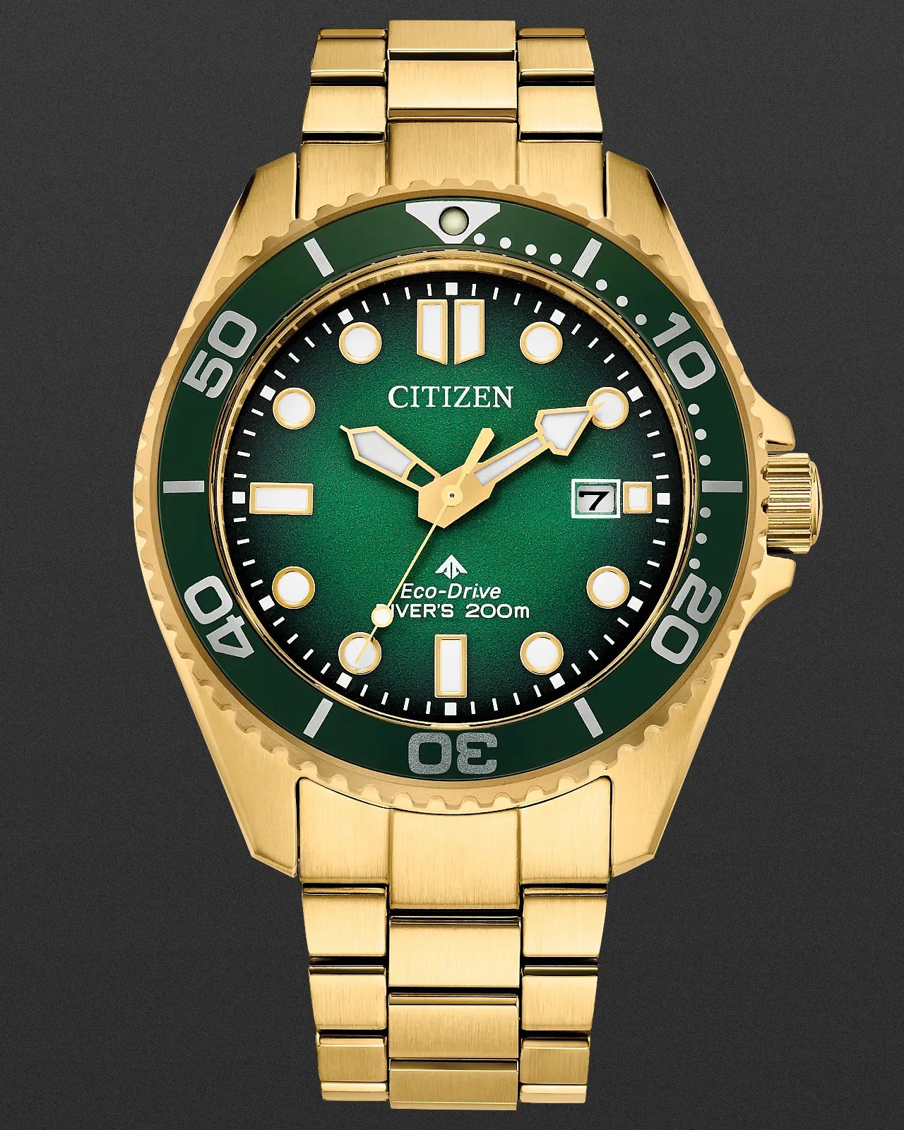 a gold and green Citizen dive watch