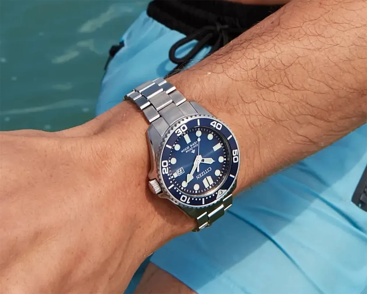 a Citizen dive watch on a man's wrist