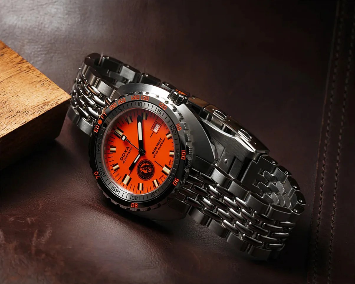 a Doxa dive watch with an orange dial