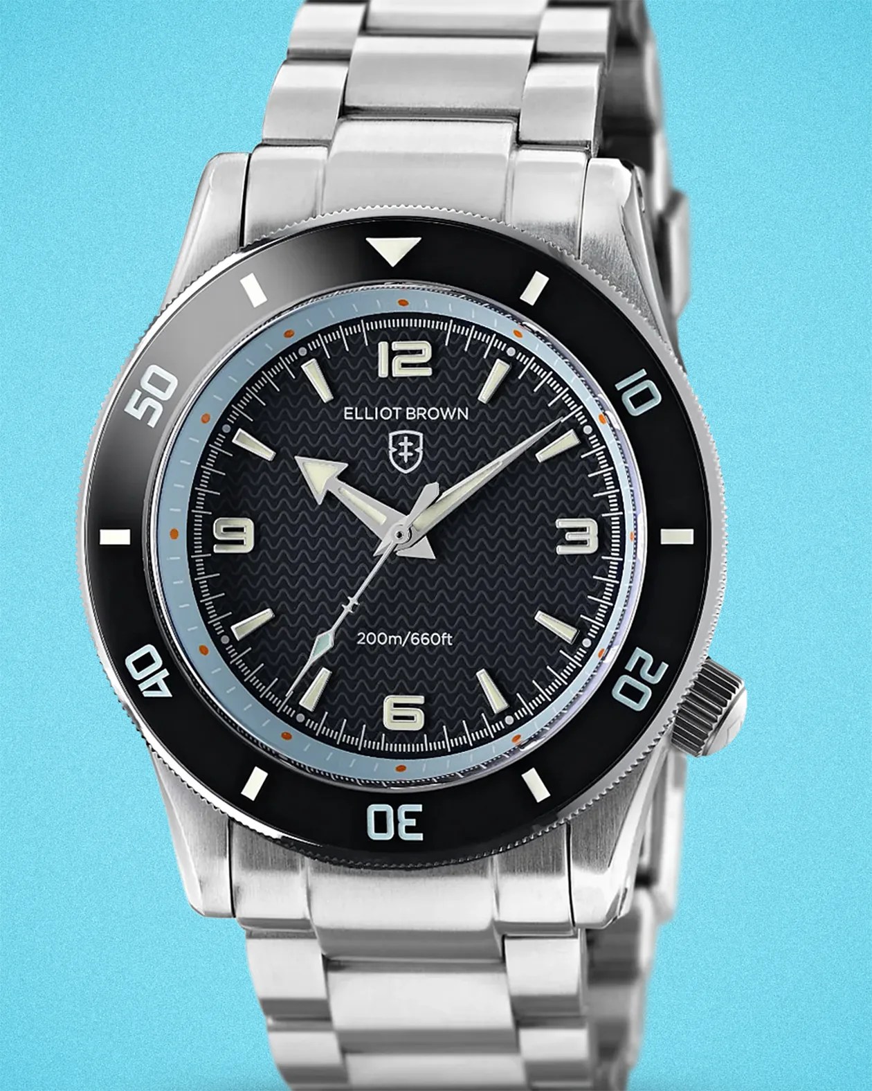 an Elliot Brown dive watch with a steel bracelet