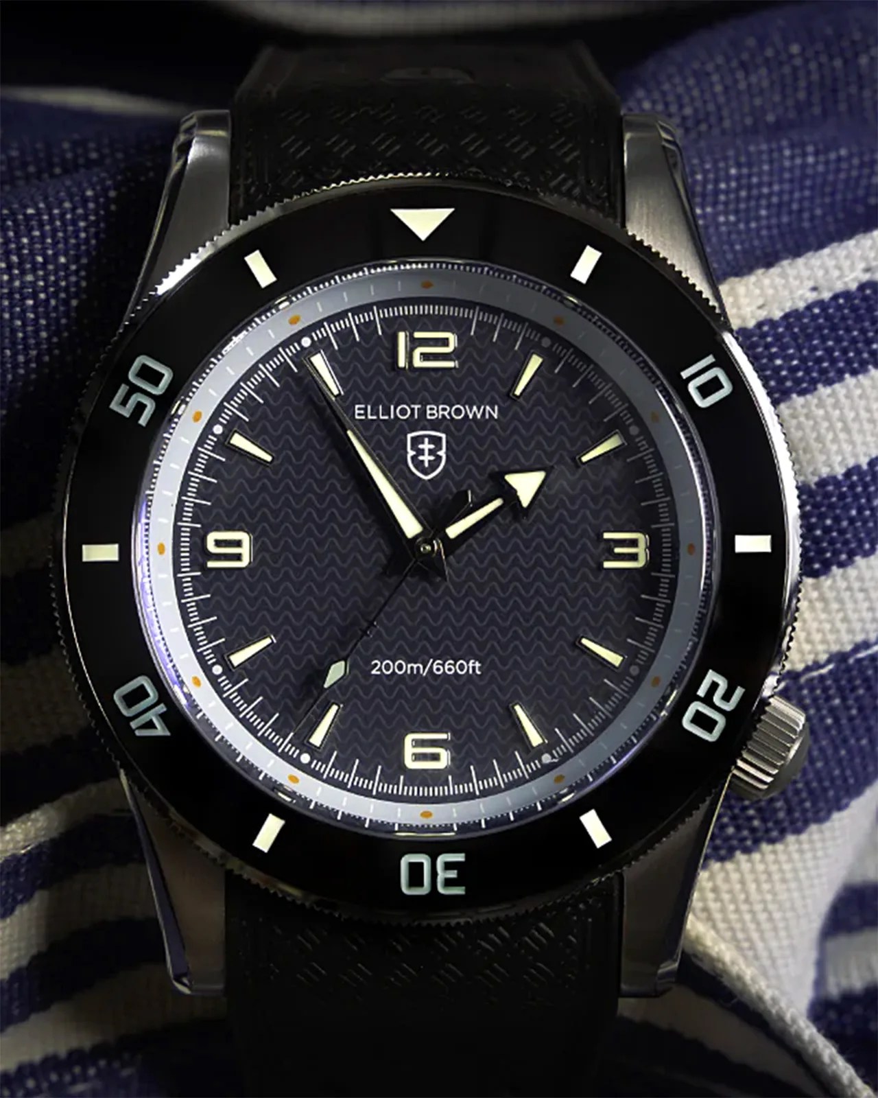 an Elliot Brown dive watch in the dark