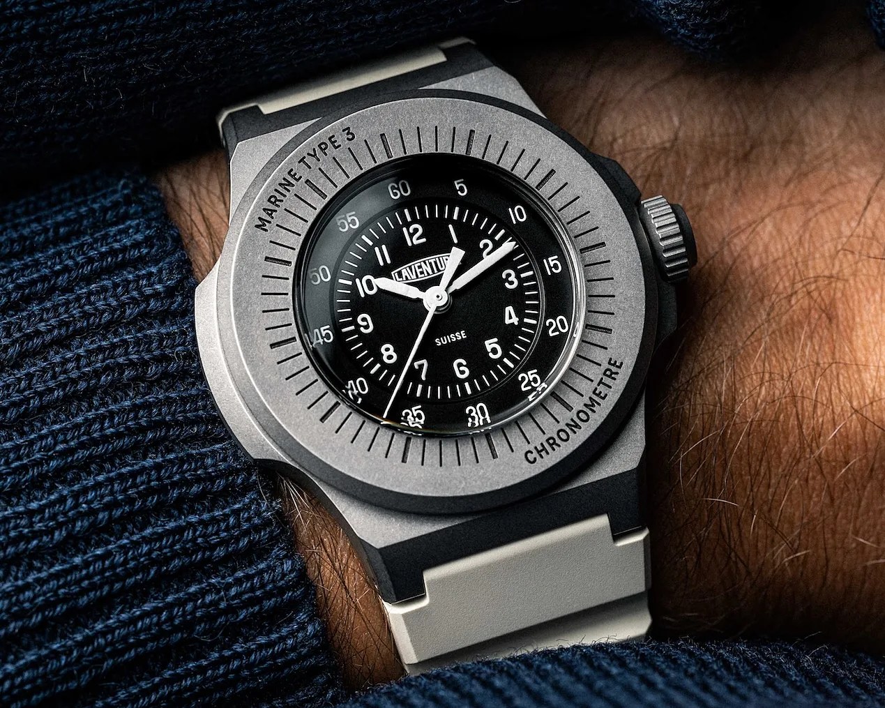 a black watch on a man's wrist