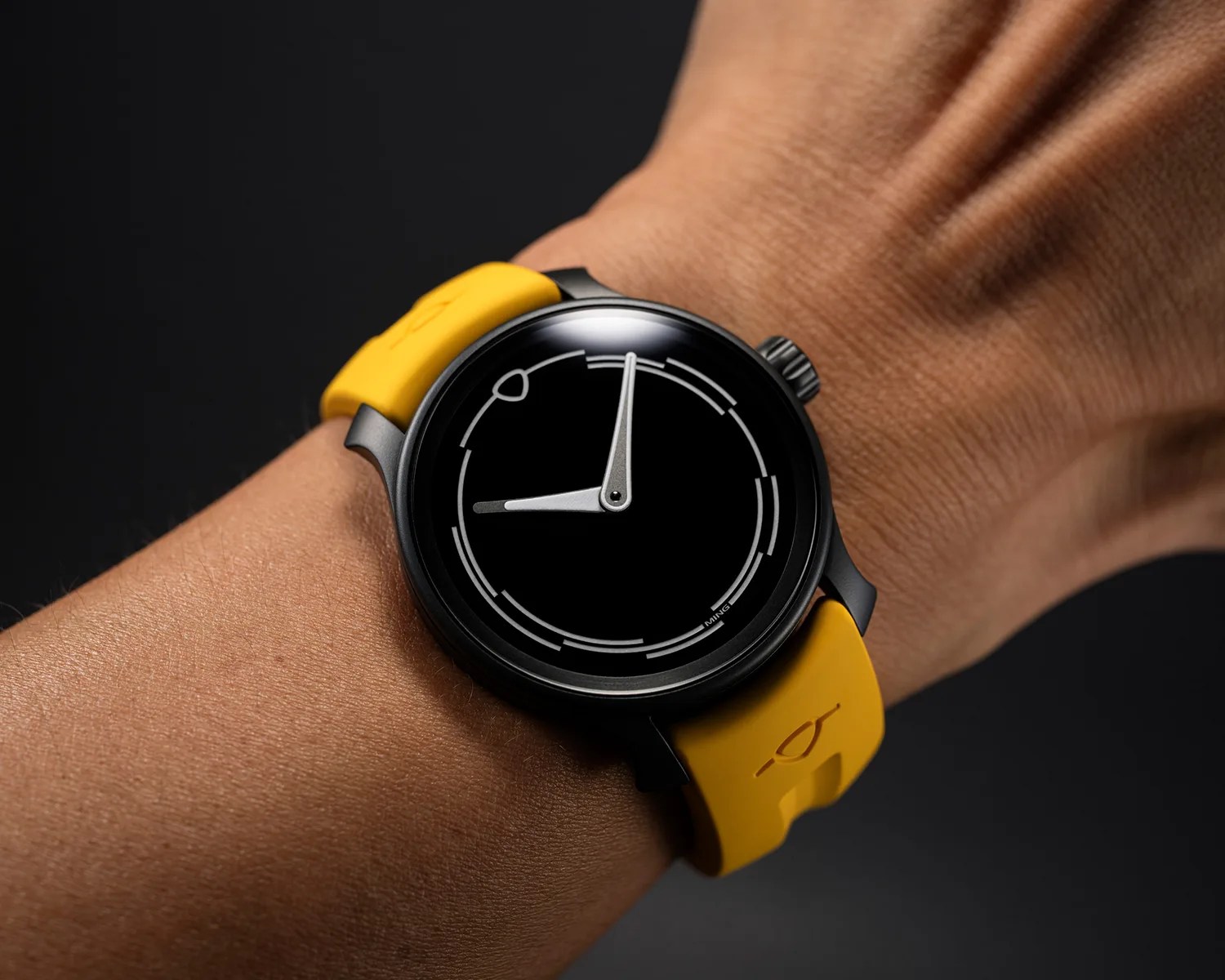 a ming watch on a mans wrist