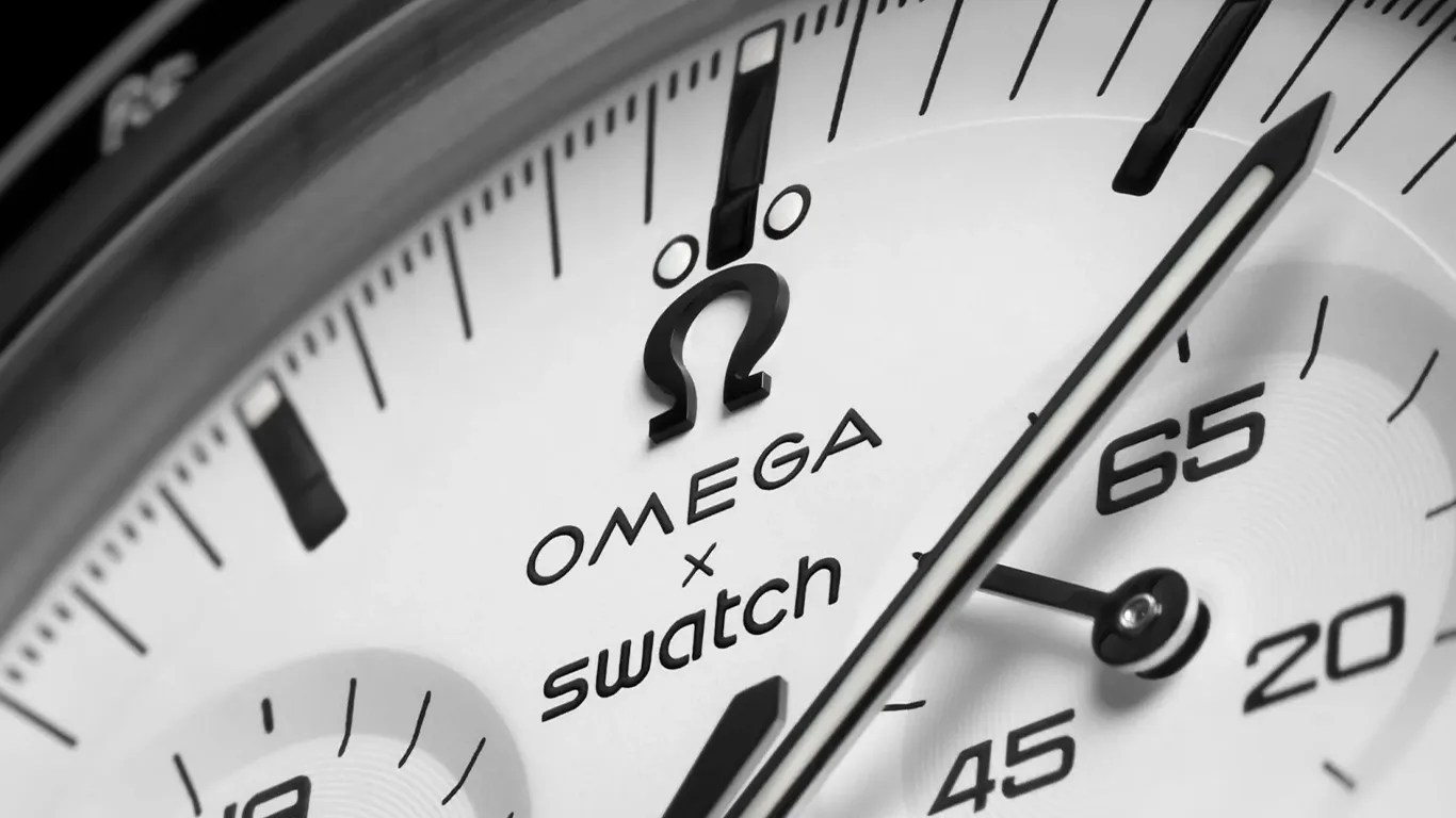 a closeup of a moonswatch watch dial